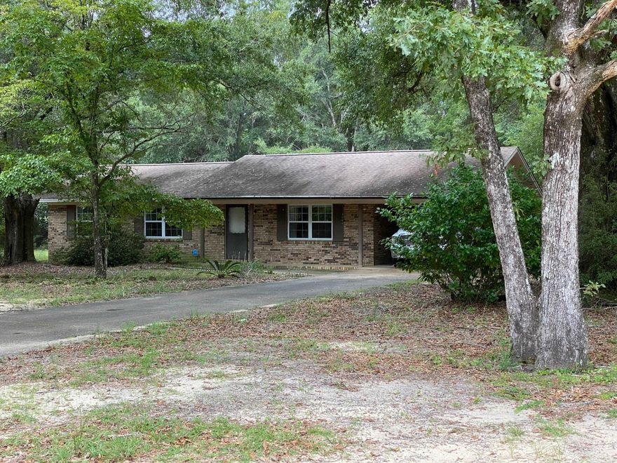 Here is an opportunity to own a 3BR 2BA home in Crestview that sits on an acre lot with beautiful mature trees and a yard that is big enough for endless possibilities. This all brick home features good sized bedrooms, kitchen/dining combo, large living room, an oversized laundry room, and a covered carport. This one won't last long, as it is priced to move quickly, so be sure to stop by and take a look!