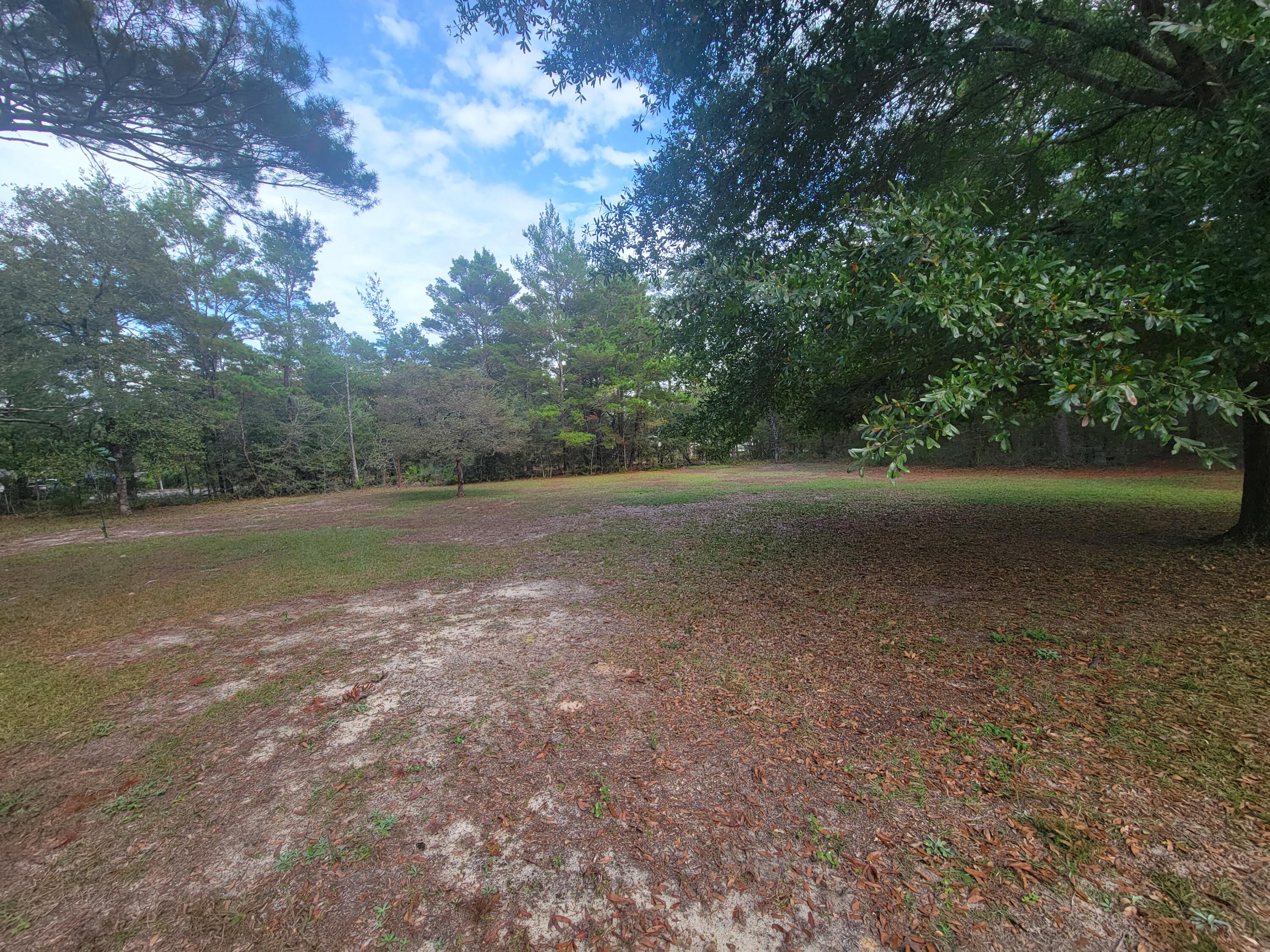 2 beautiful lots wooded lots  on your left at the cul-de-sac.  You will need a well and septic and power pole.  Manufactured homes allowed.  Others lots available in the same area available on W. May Lilly  see  MLS #963023 and MLS 963028 and MLS 963088