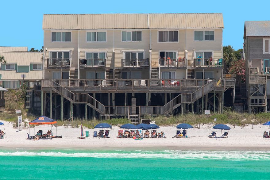 This three bedroom, three and a half bath beach home delivers stunning Gulf views from almost every room. The layout of Summer Haven 3 has a split floor design with individual guest quarters on the first and third floors with the main living area and kitchen in between onthe second floor. The entire first floor encompasses a dedicated beachfront guest quarters.The master bedroom is on the third floor. Balconies on the first and second floors lead to stairs down to your private beach. Situated right on the water, you simply can't get any closer to the Gulf. Loungeon your balcony and enjoy incredible sunrises and sunsets.This is  what Gulf front living is trulyall about. Close to Sandestin Resort, the Village of Baytowne Wharf, Grand Boulevard and other