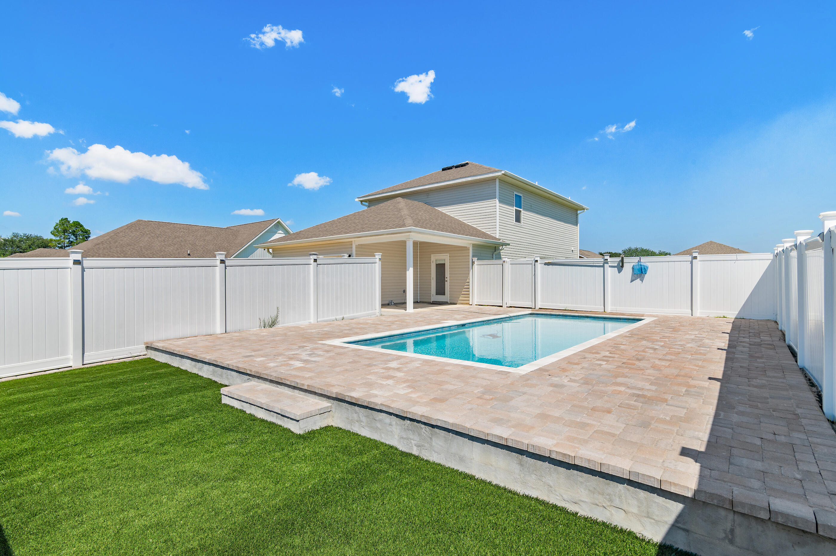 Welcome to 56 Silverthorn Drive in the sought-after Owl's Head community of Freeport, Florida. This charming two-story home, the Inzer floor plan, offers thoughtful design with the primary suite conveniently located on the main level and a spacious additional living room upstairs. Interior features include EVP flooring, ivory cabinetry, laminate countertops, and a Smart Home package with DEAKO Smart Switches for modern convenience.Step outside to enjoy one of the home's best features--an expansive fenced backyard with a large swimming pool and plenty of space for entertaining, gardening, or play. The oversized lot provides privacy and flexibility rarely found in new construction communities.Owl's Head is ideally situated near restaurants, shopping, golf courses, the E.O. Wilson B Biophilia Center, and multiple marinas. For commuters, it is just 36 miles to Eglin Air Force Base, 37 miles to Duke Field, and 23 miles to Sacred Heart Hospital.