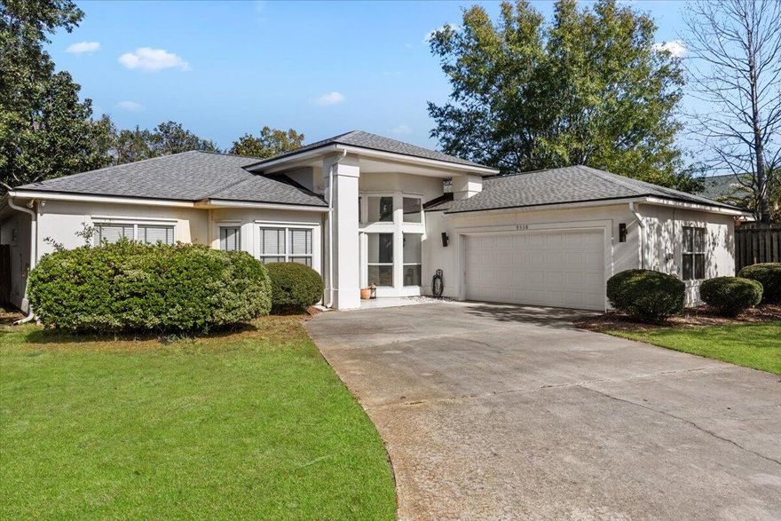 Stunning contemporary home in prime location, South of Hwy 98, near shopping, military bases and the bridge to Navarre Beach.  The sight of the Santa Rosa Sound as soon as you turn into the community will immediately lift your cares away.  The community offers a private beach, pavilion and dock for a low HOA fee of $250/year. Step inside this light-filled, modern home with an open and split bedroom floor plan and soaring ceilings.  Featuring 3 bedrooms plus an office, 2 full baths, stainless steel appliances in the kitchen, formal dining and breakfast nook as well as a great laundry room with tons of storage and an enclosed patio.  The primary bathroom is a real retreat offering dual sinks, a separate tub and shower and water closet.  One guest bedroom opens to the screened patio and has a unique feature wall. The other guest bedroom features a custom built triple bunk bed perfect for kids. The home has beautiful new tile floors throughout the main rooms with carpet in the bedrooms and modern light fixtures. This beauty is located on a generously sized cul-de-sac lot with privacy fenced yard and side entry, oversized garage. As the new owner you will have peace of mind with a new roof in 2022, new HVAC and gas water heater in 2021 and the exterior was just completely repainted in 2024. Custom features include a trash compactor in the kitchen, central vacuum, gas fireplace, built in work bench with storage shelves in the garage and high end washer and dryer included. The stove, microwave and dishwasher are all brand new in 2024.