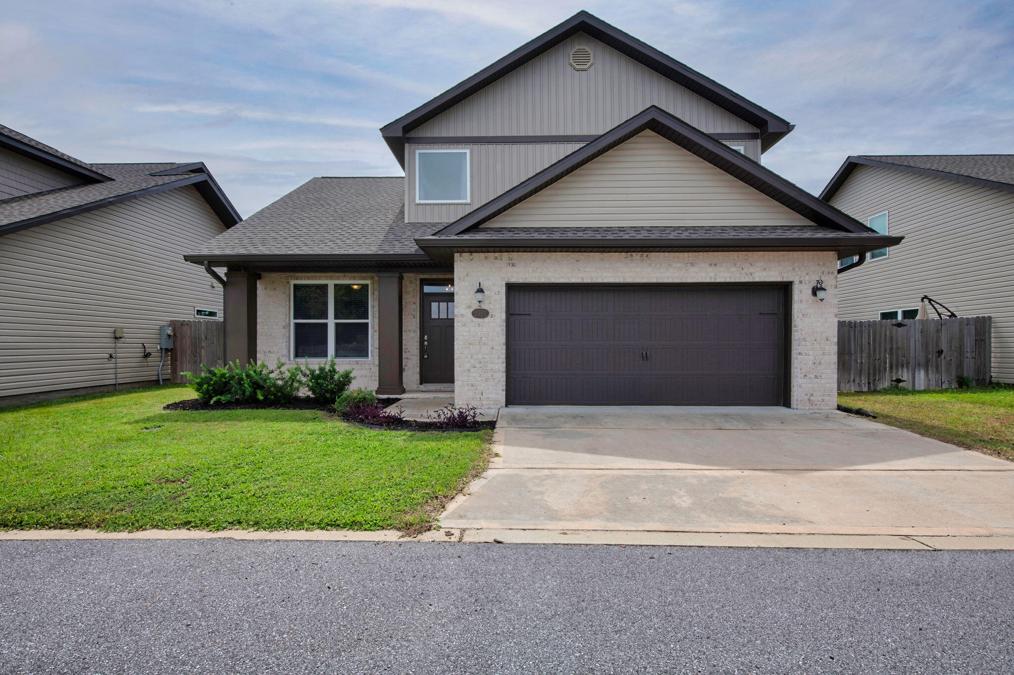 ASSUMABLE VA LOAN AT 5.125%! Step into style and comfort in this beautiful craftsman-style home built by Robbins Builders in 2022. Located in East Navarre, just a short drive to Hurlburt Field, this home blends quality finishes with a smart layout. You're welcomed by a bright foyer that opens to a spacious, open floor plan filled with natural light. The kitchen features white shaker cabinets with crown molding, granite counters, an undermount sink, stainless steel appliances, and a breakfast bar--perfect for everyday meals or entertaining. Bullnose corners and recessed lighting add a clean, modern feel throughout. Downstairs includes a flexible room currently used as an office, plus a convenient half bathroom. Upstairs, the master suite offers a large walk-in closet, double sinks with granite counters, and a tiled walk-in shower. Two additional bedrooms and a full guest bath complete the second floor. Luxury vinyl plank flooring runs throughout the home, offering both style and durability. Outside, enjoy a fenced-in yard ready for pets, kids, or relaxing evenings. The home also includes hurricane protection for windows. Built with care and filled with upgrades, this home is move-in ready and close to everything Navarre has to offer.