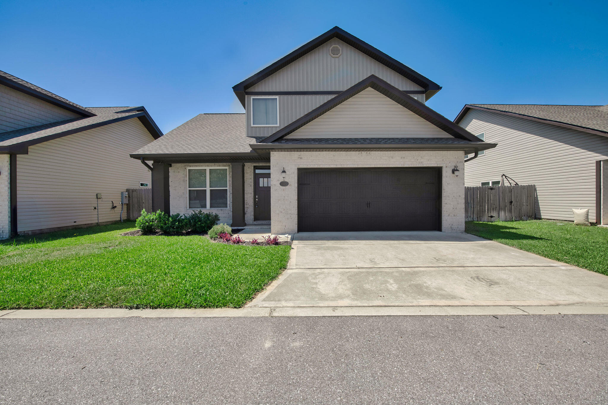 ASSUMABLE VA LOAN AT 5.125%! Step into style and comfort in this beautiful craftsman-style home built by Robbins Builders in 2022. Located in East Navarre, just a short drive to Hurlburt Field, this home blends quality finishes with a smart layout. You're welcomed by a bright foyer that opens to a spacious, open floor plan filled with natural light. The kitchen features white shaker cabinets with crown molding, granite counters, an undermount sink, stainless steel appliances, and a breakfast bar--perfect for everyday meals or entertaining. Bullnose corners and recessed lighting add a clean, modern feel throughout. Downstairs includes a flexible room currently used as an office, plus a convenient half bathroom. Upstairs, the master suite offers a large walk-in closet, double sinks with granite counters, and a tiled walk-in shower. Two additional bedrooms and a full guest bath complete the second floor. Luxury vinyl plank flooring runs throughout the home, offering both style and durability. Outside, enjoy a fenced-in yard ready for pets, kids, or relaxing evenings. The home also includes hurricane protection for windows. Built with care and filled with upgrades, this home is move-in ready and close to everything Navarre has to offer.