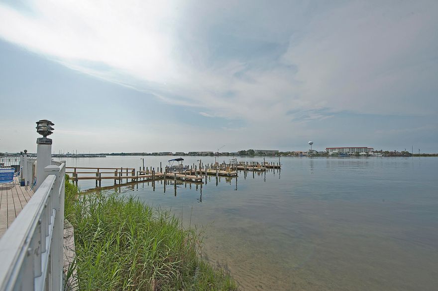 Great condo on the sound! FRESHLY painted and brand NEW carpeting. This condo is ready for you! Great rental investment, primary home or vacation condo. Can be sold with furnishings so move in and relax! Enjoy the pool, tennis courts, rec center and dock. These larger 2 bedroom 2 bath units rarely come up for sale. Don't worry about carrying groceries upstairs! This unit is on the first floor with a small patio you can enjoy. Check out the large open living and dining area with an efficient kitchen and small breakfast bar. Down the hall is a full bathroom, guest bedroom and large master bedroom w private bathroom and plenty of closet space. Call today to make your appointment and start enjoying carefree living so close to downtown restaurants and shopping. Call today to see!