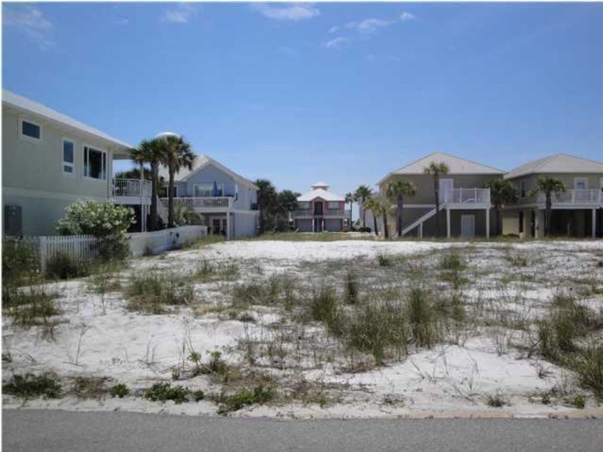 In the heart of Navarre Beach, close to all conveniences, restaurants and resorts, this Homeport lot is well located near the beaches and the Intra Coastal Waterways. This cozy development offers year round beach access, a community pool and gazebo, and a gorgeous community dock with lifts on the intra coastal, where slips can be rented for boats and jet skis. Walk to the beach and boat dock for sunset views and fishing. Build a friendly cottage in this quite development and enjoy Gulf views from the second story deck.