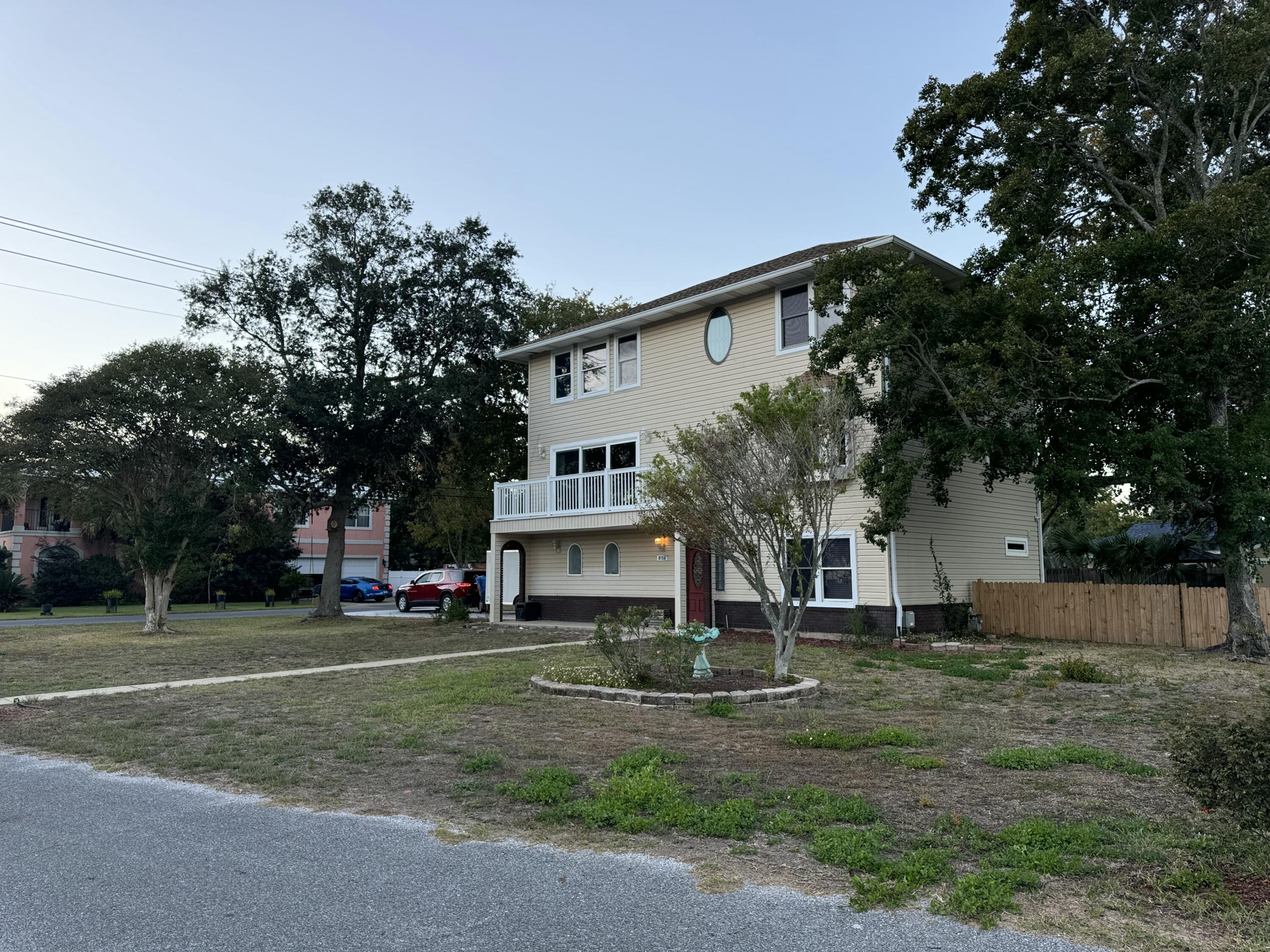 Four bedroom, 3.5 bathroom large 3 story house on a corner large corner lot. Spectacular intercostal waterviews from the second story balcony , dining area and 2nd bedroom upstairs. its just steps away  a short walk to West Navarre Park and boat launch, there is plenty of room to park a boat in the back yard or in the oversized double car garage. New roof in 2022, new hot water heater in 2017, gas heat and gas fireplace, Impact rated sliding doors and vinyl windows with Fabric Sheild shutters, The bottom floor has the garage, Large laundry room with a utility sink, Storage room with a full bath and bedroom. This is a perfect set up for a short term vacation rental or a home of your dreams Steps from the sound and public boat launch.