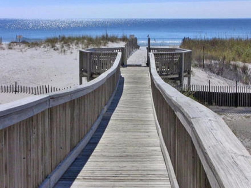 Gorgeous unit in the Terrace with fantastic views of the gulf. Large tile on the diagonal in main area, kitchen and baths. Upgraded kitchen cabinet doors. Comes completely furnished. All window treatments remain. Rich leather sofa and love seat in living room. Dining room table will be replaced with another table and nightstand with pineapple. All other furniture remains. The Terrace shares a cross easement with the Pelican which allows for full use of their facilities as well. Amenities include tennis courts, sauna, steam room, spa, game room, cafe, tiki bar and lots of social activities for all. Although it is only a 3 minute walk to the beach we also offer a free Tram ride in season.