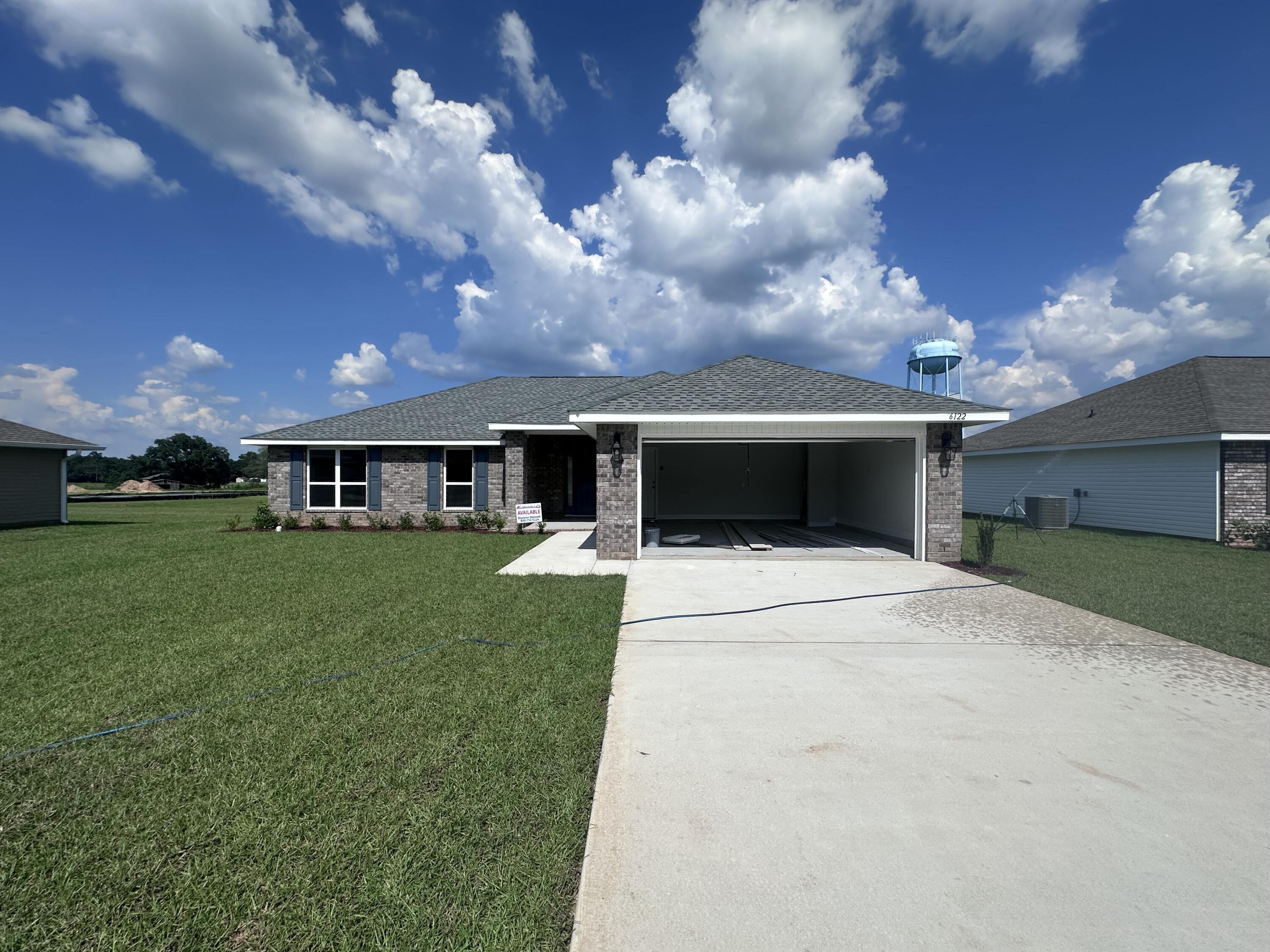 This 4/2 is a must see! Good sized lot fully sodded and professionally landscaped. The 2-car garage come with electric garage door opener. The house is 3-sided vinyl and brick front. Has a large covered front porch as well as a patio in the back. This is a split bedroom plan, and the master bedroom has a large walk-in closet. The kitchen overlooks the Great Room. The dining area is off the kitchen. All floors are carpeted except the wet areas which have LVP.