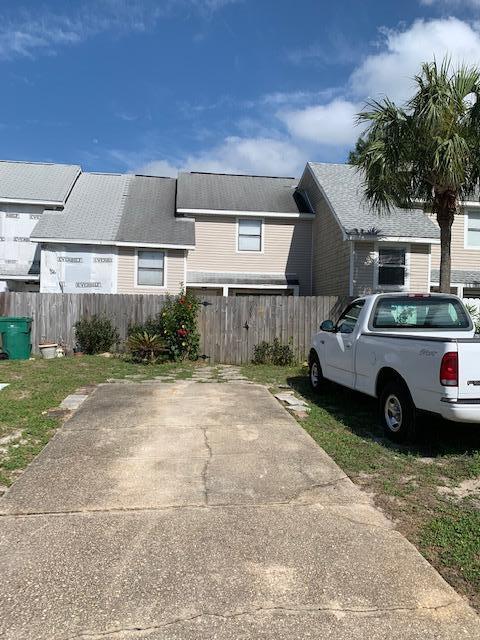 TOWNHOUSE IN A CENTRALLY LOCATED NEIGHBORHOOD. TWO LEVEL UNIT WITH SCREENED LANAI AND A FENCED PATIO IN THE FRONT. TWO BEDROOMS, TWO PRIVATE BATHS, AND LAUNDRY CLOSET ON THE SECOND LEVEL. KITCHEN WITH EAT IN AREA, LIVING ROOM WITH WOOD BURNING FIREPLACE, DINING ROOM, AND HALF BATH ON THE MAIN LEVEL. THIS TOWNHOUSE IS BEING SOLD AS IS AND WILL REQUIRE SOME TENDER LOVING CARE! CONVENIENT TO SHOPPING, SCHOOLS, ENTERTAINMENT, AND THE DESTIN AIRPORT.