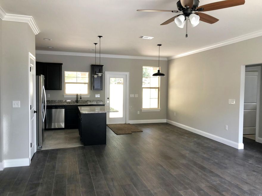 BRAND NEW 3 bedroom home located in the heart of Niceville! EXTERIOR FEATURES: All brick, privacy-fenced in yard, 2 car garage w/ auto opener, irrigation system & landscaping. INTERIOR FEATURES: foam insulation, open & split floorplan, granite in kitchen, marble bathrooms, stainless steel kitchen appliances, tile in all wet areas & foyer, carpet in bedrooms, laminate wood flooring all other areas, large crown molding in main areas, large baseboards, lots of storage. OTHER FEATURES: A 1-yr builder warranty is provided, seller will pay a TOTAL of $4000.00 towards ALL closing cost (buyers & sellers combined), title & closing to be held with Tammy Jones at First National Land & Title.