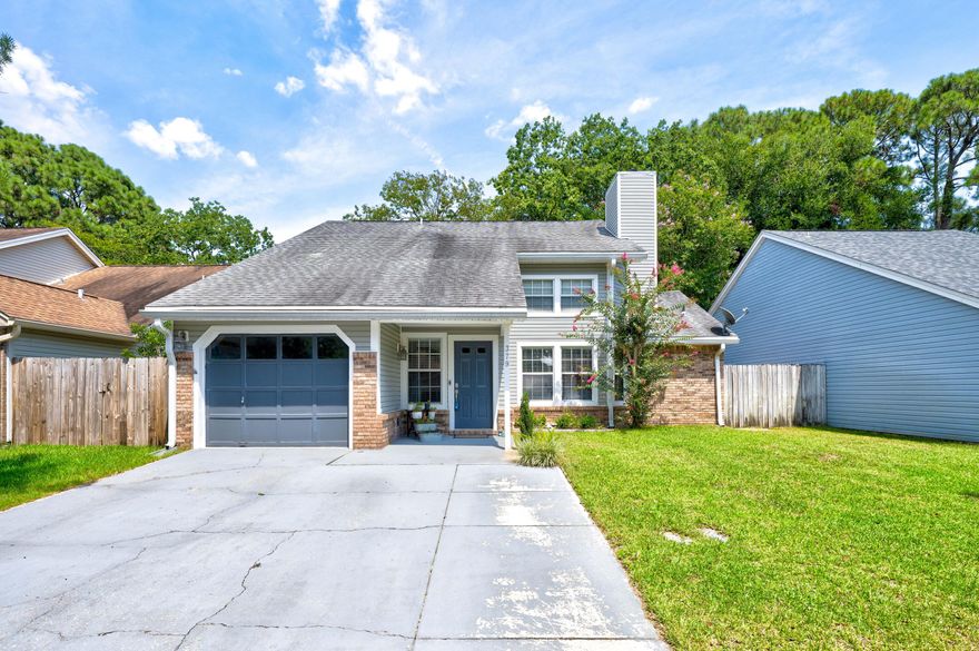 Conveniently located just minutes from the shopping and dining that Ft Walton Beach has to offer. You'll enjoy the expansive ceilings in the living room as well as the wood burning fireplace. The kitchen offers abundant cabinet storage, an island with breakfast bar overlooking the dining area, a flat-top stove, and granite countertops. The primary suite is located on the first floor of the home, is suitable for a king-size bed, and comes complete with an en-suite bathroom featuring a walk-in shower and modern vanity. Each bedroom boasts ample footage and windows for plenty of natural light, with upstairs bathroom recently being remodeled with new tub and floor to ceiling subway tile around as well as new vanity and sink. Heading towards the backyard you will find a shady pergola the