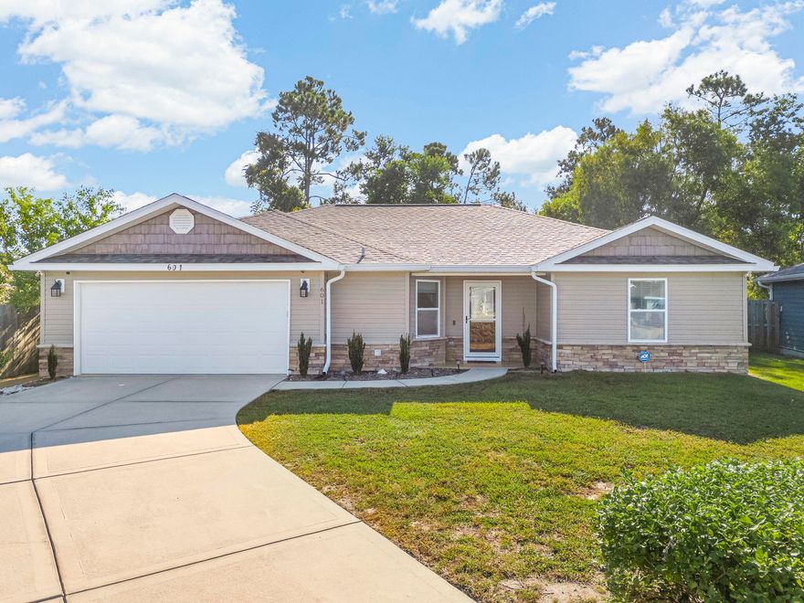 Welcome to 601 Diamonte Circle, a beautifully designed 3-bedroom, 2-bath home blending style and function. The open-concept living and dining area flows seamlessly into the kitchen, perfect for entertaining or everyday living. The primary suite features tray ceilings, two walk-in custom closets, and a private bath, with additional custom closets throughout the home. Enjoy the garage with epoxy flooring and a spacious screened-in porch with winter paneling for year-round comfort. Step outside to your new 2024 hot tub, included with the sale and used only four times. Conveniently located near Tyndall AFB, schools, shopping, and all that Panama City has to offer.