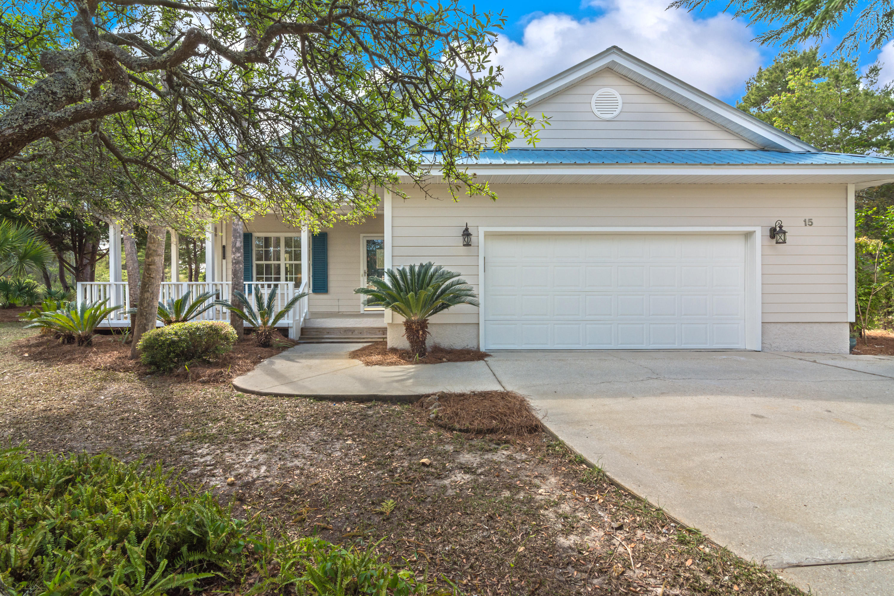 THIS PROPERTY WILL NOT LAST! Gorgeous home in tranquil setting, located just minutes to the Ed Walline Public Beach Entrance and Gulf Place with restaurants & shopping! Amazing upgrades! This owner spared no expense with the kitchen and bath renovations! Exquisite flooring, granite counters and bathroom vanities, amazing amounts of cabinetry, SS appliances, Bosch gas stove , SS ventahood and cooktop, microwave drawer and more make this a find! This home is situated on a corner lot with gorgeous tropical landscaping! Relax on the large wrap porch and view your park-like scenery, The living area is complete with fireplace with custom surround, large kitchen island, spacious dining area, master suite with renovated master bath, two spacious secondary bedrooms, 2 Car Garage and much more!