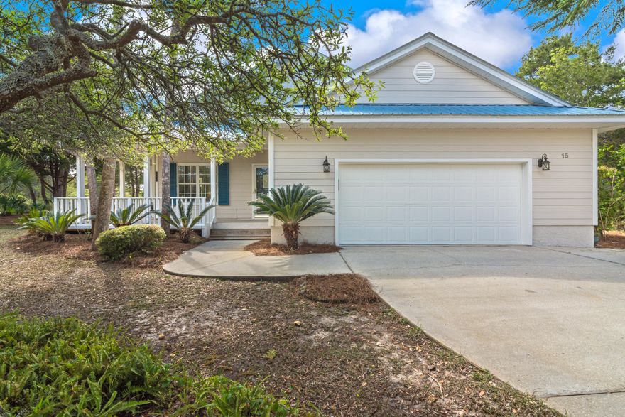 THIS PROPERTY WILL NOT LAST! Gorgeous home in tranquil setting, located just minutes to the Ed Walline Public Beach Entrance and Gulf Place with restaurants & shopping! Amazing upgrades! This owner spared no expense with the kitchen and bath renovations! Exquisite flooring, granite counters and bathroom vanities, amazing amounts of cabinetry, SS appliances, Bosch gas stove , SS ventahood and cooktop, microwave drawer and more make this a find! This home is situated on a corner lot with gorgeous tropical landscaping! Relax on the large wrap porch and view your park-like scenery, The living area is complete with fireplace with custom surround, large kitchen island, spacious dining area, master suite with renovated master bath, two spacious secondary bedrooms, 2 Car Garage and much more!