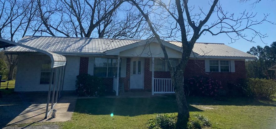 This well maintained home in the country is calling your name! Situated under mature, producing pecan trees and stately oaks is this 3BR 1BA brick home on 19.34 acres of perfection. Part cleared hay field/pasture, part wooded, this property has it all. There is a spring-fed pond in the edge of the wood line and a creek running through the back of the property. Bring your livestock! A fenced portion of the property, just outside the backdoor, is perfect for the dogs. The property has Mossy Head public water (with tap fee paid), but is currently hooked to well. There are two septic tanks on the property. The garage is detached and is a solid block building. It could easily be remodeled into a mother-in-law suite. Don't miss out on this country paradise! Seller is motivated! Bring offer!
