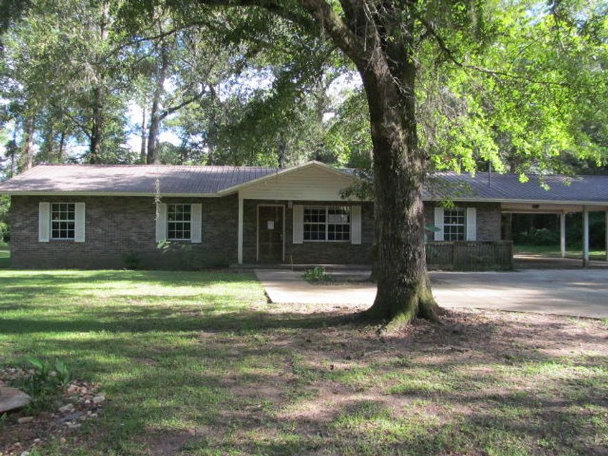 REO. Secluded 3 bedroom 2 bathroom brick home waiting for you! Located at the end of a dead end road nestled away in Holmes County. Home features a living room, dining area, kitchen, family room, and a large florida room! Needs some TLC but is a great family home on an acre! Call today to schedule your tour! Property sold ''as-is.''