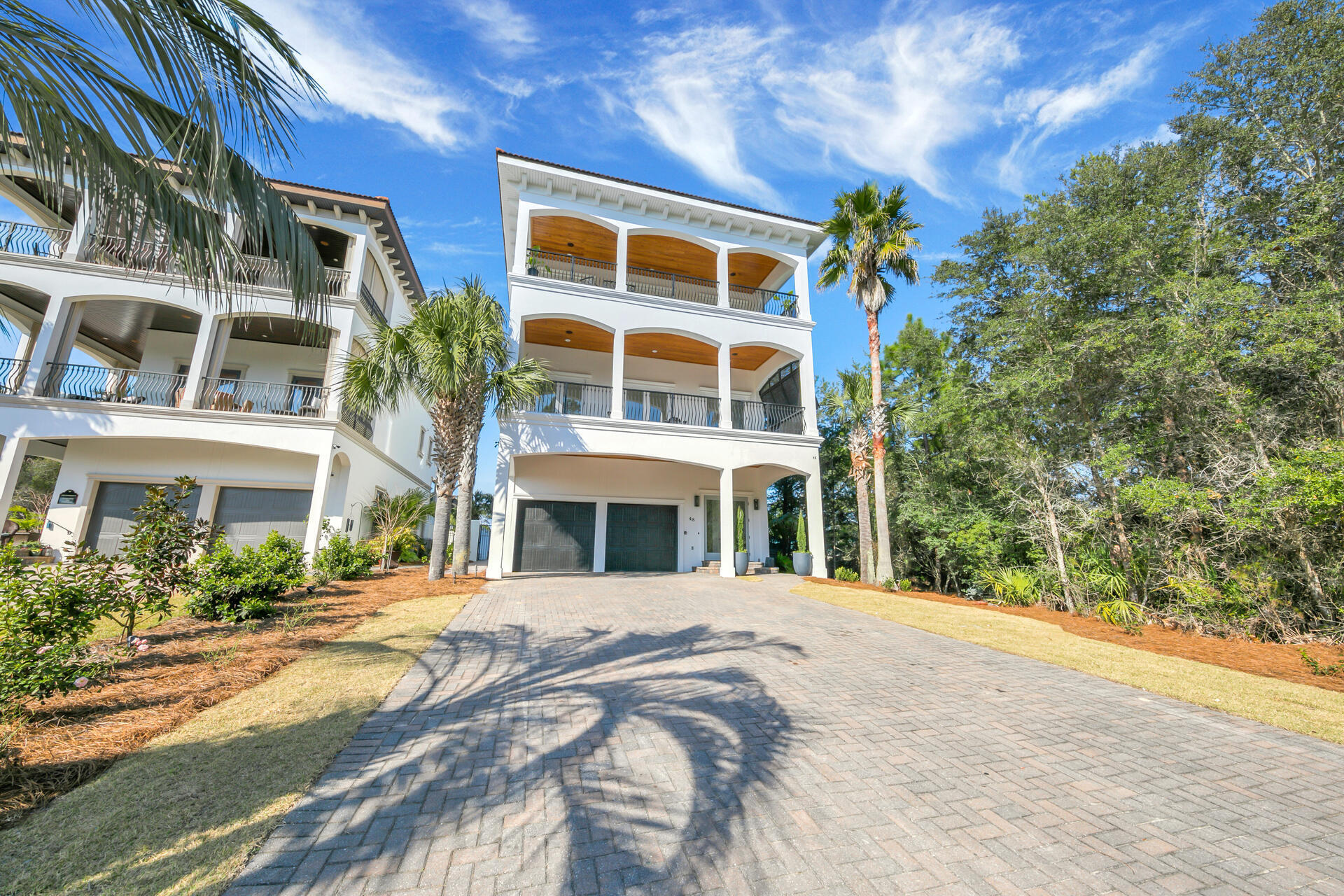 Bring All offers - Great rental capacity. Completely updated and remodeled from top to bottom, this home prominently overlooks Topsail State Park with Gulf Views from main living area. The 5 bedroom, 4.5 bath Mediterranean inspired home is unique in its location with unobstructed views and peace and quiet of the state park. It's modern finishes flow through each Two master suites, two bunk rooms, and guest room - all designed to host large families. A 3 stop elevator, 12' ceilings and oversized bedrooms and bathrooms. Each floor has front and back decks and adding to its grandeur its beautifully appointed shaded patio lanai with outdoor kitchen, adds appeal to heated pool and jacuzzi. Oversized two car garage with massive space for beach toys and golf cart. 3 beach accesses within 1/2 mile