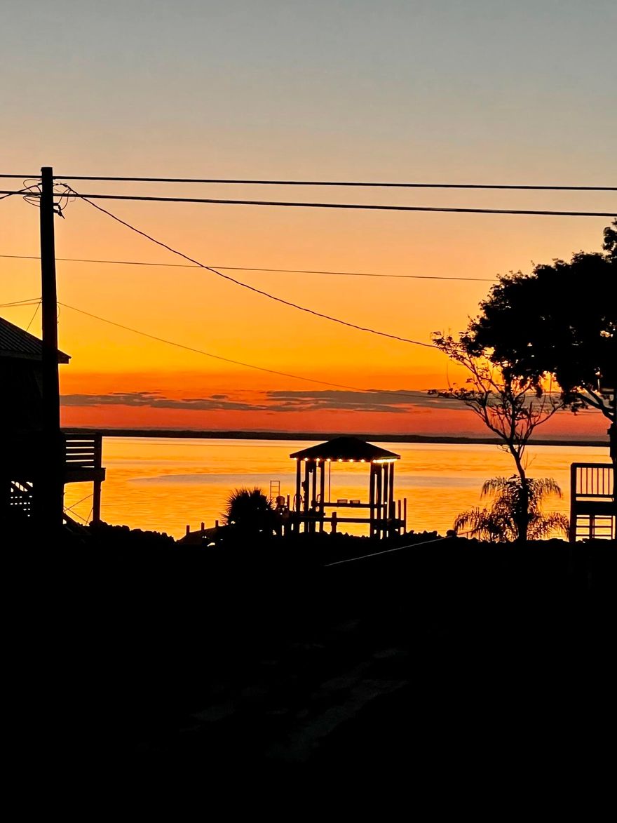 Welcome to 1360 La Paz Street, a rare waterfront retreat offering the perfect blend of coastal charm and modern updates. Nestled on a quiet canal with direct bay access to the Gulf, this home is designed for those who love the water and the outdoors.

Step onto the covered wraparound porch, where you can take in serene bay views from the front and enjoy breezy afternoons overlooking the canal from the side and back. A brandnew dock and paved boat launch make it effortless to set out for a day of boating, fishing, or sunset cruising.

Inside, the home has been thoughtfully refreshed with updated paint, vinyl flooring throughout, and a modernized kitchen and bathrooms. The kitchen features a gas stove and updated finishes, while the bathrooms offer clean, contemporary style. Every detail has been considered to create a movein ready home that feels both comfortable and stylish.

The outdoor living spaces truly shinewhether you're sipping coffee on the porch, entertaining friends by the water, or launching your boat for a day on the bay, this property is built for enjoying the Florida lifestyle. The refreshed exterior adds to the curb appeal, making this home as inviting outside as it is inside.

With its prime waterfront location, updated interiors, and unbeatable access to the bay and Gulf, 1360 La Paz Street is more than a homeit's a lifestyle.