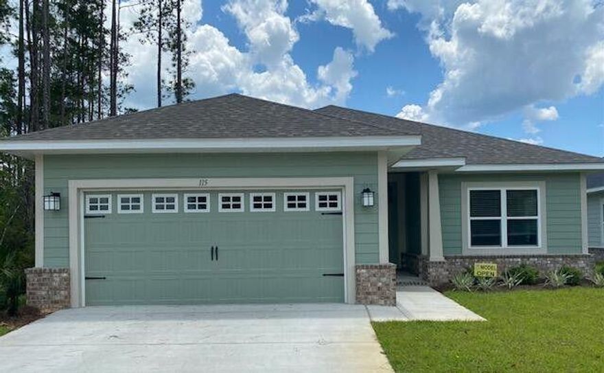 Discover the perfect blend of comfort and style in this beautiful 3-bedroom, 2-bathroom Craftsman home, located in the desirable Riverwalk Subdivision--just a 15-minute drive to Blue Mountain Beach! With a front-facing view of the scenic retention pond, this property offers both tranquility and convenience.Step inside to find 9' minimum ceilings throughout, with a vaulted ceiling in the Great Room and a Trey ceiling in the Master Bedroom, adding to the spacious feel. The 8' entry doors, granite countertops in the kitchen and baths, and CoreTec Pro Plus vinyl plank flooring in the main living and wet areas provide durability and elegance. The cozy bedrooms feature plush carpet, while the huge walk-in master closet ensures ample storage. Enjoy the outdoors with a large covered back porch. The back porch is accessible from both the living area and master bedroomperfect for relaxing or entertaining. The Master Bath boasts a separate garden tub and shower, offering a spa-like retreat.

Riverwalk residents also have access to the community clubhouse, an inviting space for relaxation and social gatherings. Plus, the garage includes a newly installed mini split, adding extra climate control options.