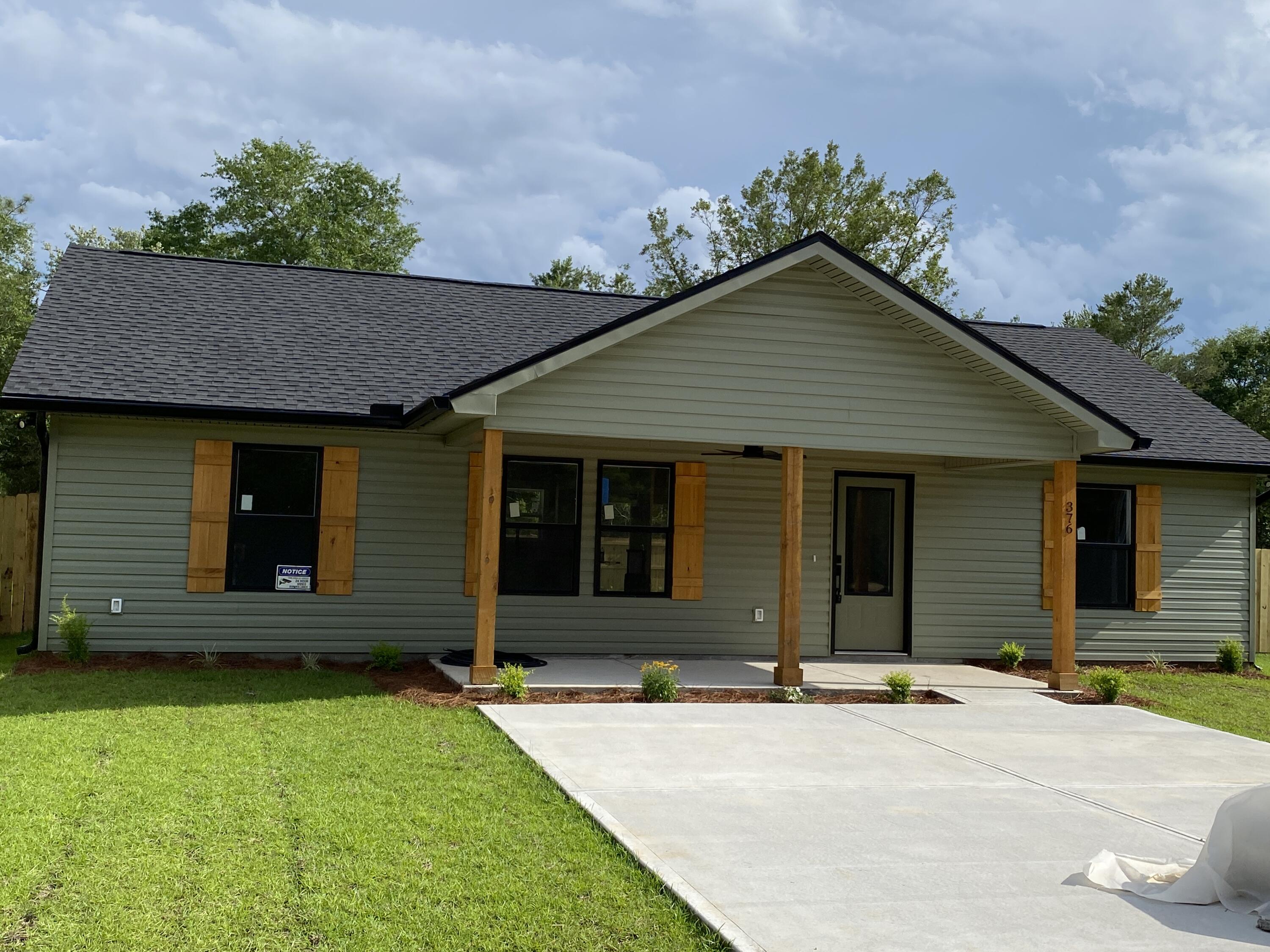 Discover modern living in this beautifully crafted 3-bedroom, 2-bathroom new construction home by Darby Homes, Inc. Nestled on a spacious quarter-acre lot, this home offers the perfect blend of style, comfort, and functionality.Step inside and be greeted by an open and inviting layout, highlighted by a vaulted ceiling in the living room that adds a sense of spaciousness and grandeur. Luxury vinyl plank (LVP) flooring throughout and recessed lighting create a warm, welcoming ambiance. The kitchen features soft-close doors and drawers on all cabinets, offering a touch of elegance and convenience, while built-in wooden shelving in all closets and the pantry adds thoughtful organization and a custom feel.Continued... Three generously sized bedrooms, including a serene master suite, provide plenty of space for rest and relaxation. Enjoy outdoor living with a fully fenced backyard, ideal for pets, play, or gardening. The large lot ensures plenty of space for future projects or outdoor entertaining.
Situated on a quiet road scheduled to be paved in 2027, this home is set to enjoy both peace and future accessibility. This is your opportunity to own a brand new home in a growing area - your dream home awaits! Schedule a tour today!