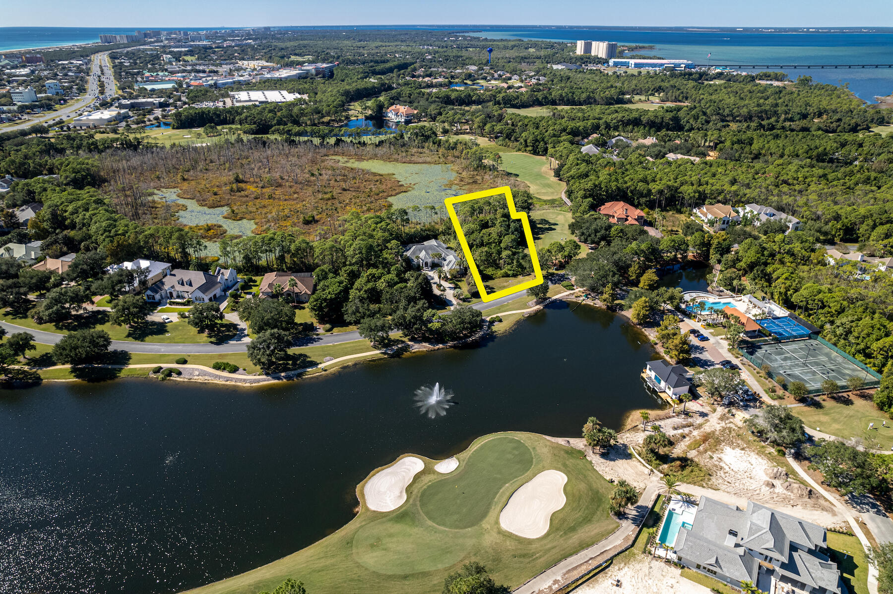 329 Regatta Bay Boulevard is a spectacular and rare estate-sized homesite measuring approximately 1.49-acres, located directly across from this influential golf course community's pool and amenities facility and within 1/2 mile to the impressive front main entrance, which is guard-gated. The expansive dimensions of this amazing lot will accommodate an array of custom home plan designs and orientations, while still providing the owner a stately drive in the front with plenty of private greenspace in the backyard for an array of outdoor features. The lot is adjacent to the gorgeous golf course, voted as among the finest and most preferred along the Emerald Coast of Florida. Legendary Marine is conveniently accessible through the owners' rear gate, as is... Destin Commons and Whole Foods. Access to our Country's most fabulous beach would be most convenient via Crystal Beach, located directly South from the main entrance. The rarity of a vacant lot of this scale and caliber in one of the most prestigious 'country club' community's in Destin is becoming increasingly noteworthy; consequently, even in the event you are not ready for immediate construction, there is logical merit to acquire and hold this coveted parcel until you are ready to have your dream home constructed with the then most advanced, latest technologies and structural engineering homebuilding will have to offer. The seller will be providing a new boundary survey. Please inquire for further details.