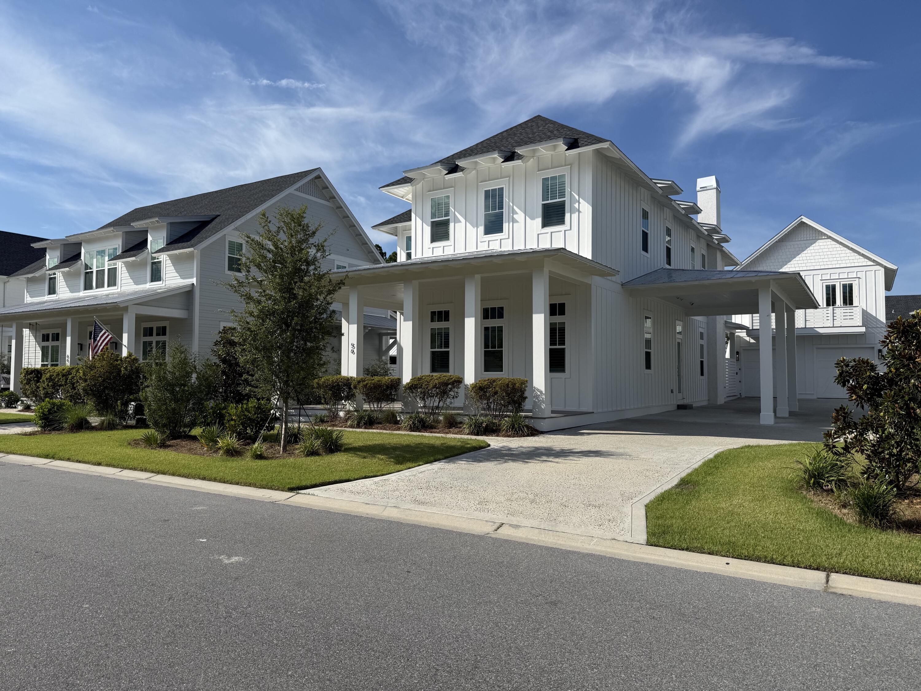 This exceptional Topsail Plan by Cole Construction offers luxury, comfort, and function in the highly sought-after Greenway phase. Move-in ready and in like-new condition, the main home features 4 bedrooms, 4.5 baths, and a separate 1 bed/1 bath carriage house with full kitchen - ideal for guests or extended family. Step into a grand entryway with soaring statement ceilings that set the tone for the elegant interiors. The open-concept main level boasts 12' ceilings, engineered wood flooring, shiplap throughout the common areas, quartz countertops, and a GE Monogram appliance package in the chef's kitchen. The first-floor primary suite includes a luxurious ensuite with a spacious walk-in tiled shower. Upstairs, you'll find three additional bedrooms and a second living area - perfect for a media room or kids' retreat.
Designed for seamless indoor-outdoor living, 16' sliding doors lead from the living room to expansive covered porch areas. The outdoor space is truly a retreat, featuring a private pool and spa, summer kitchen with built-in grill and fridge, and a charming cabana with outdoor fireplace. Additional upgrades include plantation shutters, an interior fireplace, and 10' ceilings on the second floor. Lightly lived in by the builder for just one year - 1-year warranties still in effect. A rare opportunity to own a thoughtfully designed, turnkey home in a highly desirable phase of the Watersound Origins community.
The Watersound Origins community offers an unparalleled lifestyle in South Walton - exceptional amenities, notoriously friendly and welcoming atmosphere, zero short-term rentals, and close proximity to all that 30A and Inlet Beach has to offer. Enjoy the zero-entry pool, playground, sports courts, and fitness center at the Village Commons, play a round of golf or foot golf at the Origins Golf Course, or take a walk along the many miles of walking and biking trails that wind all throughout the neighborhood! The new Watersound Town Center located at the entrance to the community offers several fantastic dining options (casual and formal), medical services, Starbucks, Publix, a Pavilion that hosts events year round, and more!