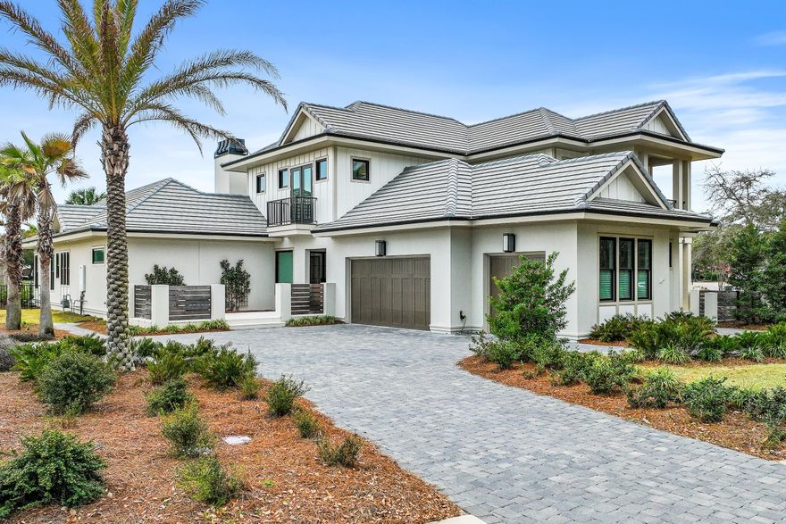 Less than a mile from the beach! Welcome to Tradewinds, the newest community in Regatta Bay consisting of 54 homesites with a West Indies/Dutch architectural influence. This beautiful home was built in 2023 and offers modern luxury indoor/outdoor living w/ 4797 sq. ft. of heated/cooled space, 4 beds, + study, 4 full baths and 2 half baths. Exterior features include an outdoor living space overlooking the golf course and lake with covered and uncovered space for entertaining and lounging, summer kitchen, pool/jacuzzi and fire pits. This home features lush landscaping that is maintained by the association, paver driveway and a 3-car garage plus golf cart garage. Click more for additional info. The home was finished with designer chosen selections throughout including shiplap, Venetian Plaster, tumbled travertine & wood flooring, quartzite & marble countertops and solid wood custom cabinetry just to name a few. The 1st floor offers a split floor plan and includes a family room w/gas fireplace, dining area, gourmet kitchen with all the bells and whistles, scullery with additional kitchen appliances, butler's pantry, wet bar, study, powder bath for guests, laundry room and a guest suite with private bath. The master suite is also located on the 1st floor and features a custom cathedral ceiling with painted wood beams, sitting area and a showstopping master bath which includes separate his and her walk-in closets, separate his and her vanities, separate his and her water closets, a large custom marble tile shower, soaking tub and last but not least a master laundry room! The 2nd floor offers a large entertainment space with wet bar, powder bath for guests, 2 guest suites with private baths and a laundry room. Built by Legendary Home Builders utilizing the most current technology for each build using only the finest materials and high-end finishes such as: wind and impact resistant windows, wind and impact rated doors, insulated, wind and impact rated garage doors, foam spray insulation in roof for superior energy efficiency, insulation in all interior walls for energy efficiency and sound proofing, insulation between floors for sound barrier, stucco homes equipped with Enviro-dry liquid waterproofing house wrap, gas lanterns, stainless steel door hinges, custom wood shelving in all closets, Kohler plumbing throughout, all showers have KBRS waterproofing systems specifically designed to maintain integrity & durability, air conditioning zones for maximum efficiency, Rinnai tankless water heaters, custom solid wood cabinets throughout with soft close hinges, smart home technology customizable for homeowner, LED lighting throughout.