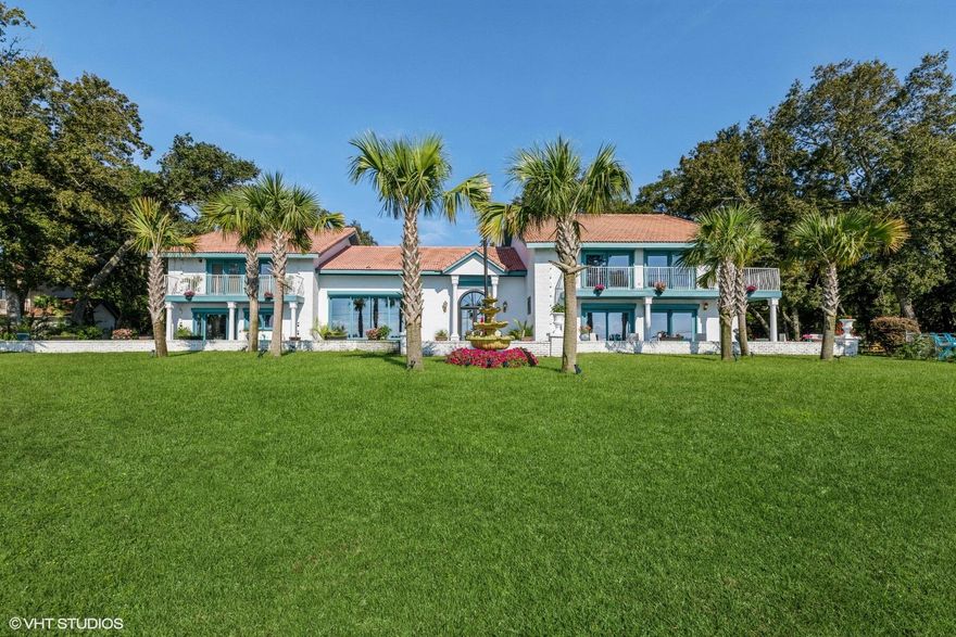Nature lovers Park to come home to- Set up as a private resort -Over 9000 sq feet of living with the main house & guest house combined. Main house offers 7 bedrooms & 7 baths & 2 half baths. Guest house has 3 bedrooms & 3 baths. 3 kitchens total -Over 400 feet of Bay frontage. Panoramic views of sunrises & sunsets. Dolphins & Eagles can be seen- over 130 mature trees on the property. Private beach that jets right into the bay. Over 80 linear feet of balcony facing the bay. Main house- 6 entrances & exits - 1400sq ft living room with over 20' ceilings, sleeps over 24. No rental restrictions. 3 large entry gates- front, rear and side. 3 fireplaces, brick, & custom marble. 3 safe rooms. 2 sep wells for irrigation- Bring your horse, boat, & seaplane. Hurricane shutters- Endless opportunities.