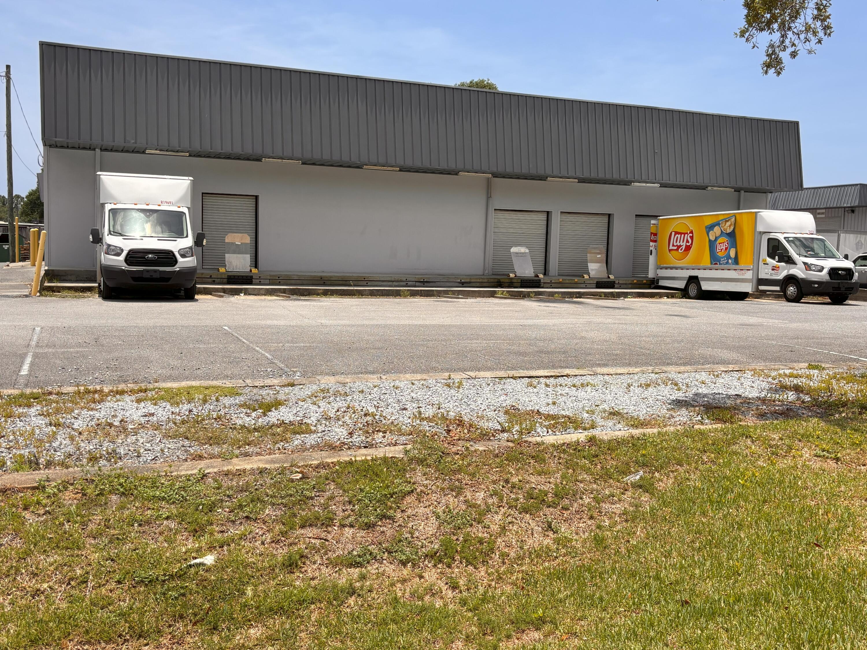 You won't find a more versatile and functional light industrial/flext building in Fort Walton Beach.! The building include a dock high door that will accomodate a full size 18 wheeler tractor trailer. also multiple semi-dock high doors in the front. The building also includes (2) oversized grade-level doors on the east and west sides of the building. A virtual tour of the buiilding can be found at the following link: https://tour.pivo.app/view/04533550-ff17-4766-8ed6-90f396fcd747