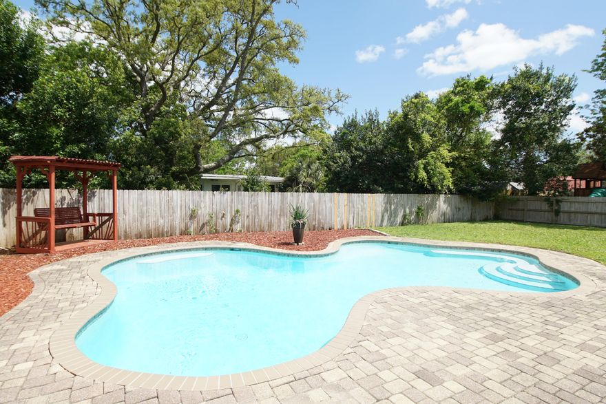 Step through the leaded glass front door to this updated home in the heart of Ft Walton Beach, close to downtown with all it has to offer: restaurants, museums, art galleries, boutiques and The Landing, the ''event central'' for festivals and special events. On the main level are the open kitchen/dining area and living room, accented with an arched opening and columns. The kitchen has newish cabinets with lots of storage space.  Many rooms have been updated with crown molding, including the hallway and baths.  Additional features include raised panel doors, can lights, simulated marble vanities, skylight.The guest bath has new plumbing and tub, and double vanity.