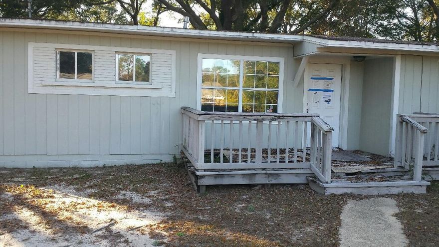 Property is being sold at lot value. The home is in need of much repair. Lot is fenced with mature trees.