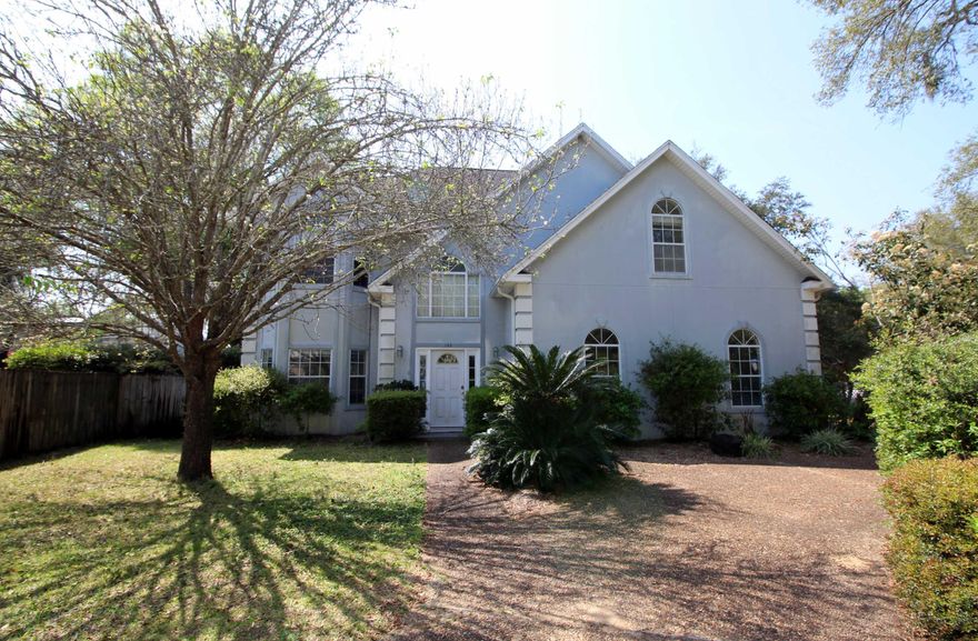 A HOME WITH ROOM TO PLAY! Step into the foyer to find a high volume ceiling and an oak open staircase that leads to the upstairs landing. Formal living room with a bay window. Formal dining room with crown molding, chair railing and large window overlooking the backyard. Charming kitchen with lots of room to gather around the cook in the house. Kitchen has a center island with a table height breakfast bar, lots of cabinets to include a desk area, two pantries and tile flooring throughout. Breakfast area placed in a bay window with access to the patio. Spacious family room with fireplace, recessed lighting and double French doors that lead to the patio. Master bedroom has vaulted ceiling and two closets one of them is a walk-in. Spacious master bath with two separate vanities
