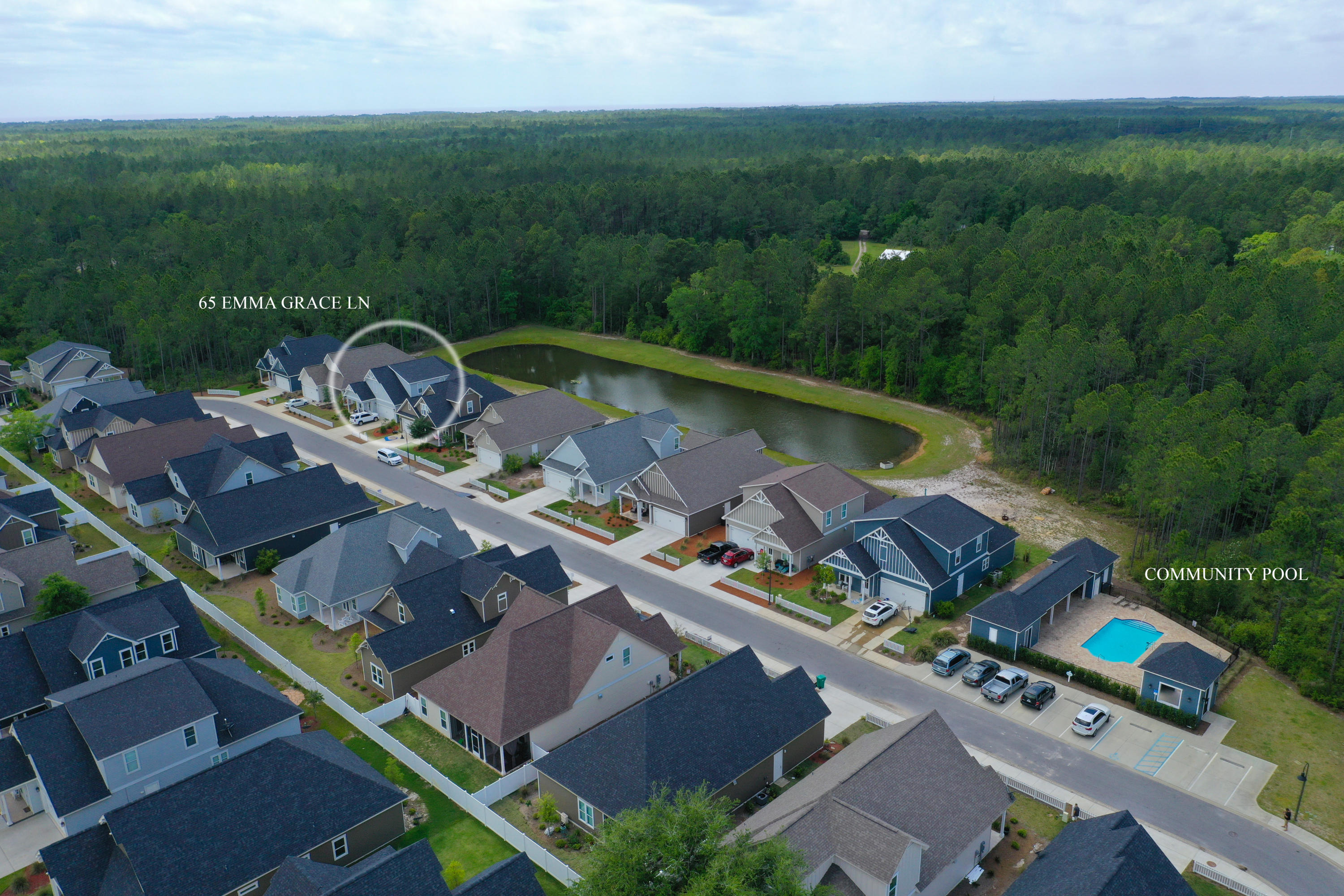 This lake front custom home with 4 bedrooms, 3.5 baths, plus home office and 2 car garage is located in Paradise Cove and is just steps to Emerald Coast Middle School. The interior offers approximately 2,880 square feet and features high end finishes, fireplace, stainless steel appliances, wood flooring, crown molding, granite countertops and white cabinetry throughout. The great room, kitchen, dining, master suite, private office with double door entry, half bath and laundry room are situated on the first level. The second level features a kids loft/ flex space, bedroom with private bath, 2 additional bedrooms and bath. The exterior space features a screened-in porch, fenced in back yard for the pups, outdoor shower, native landscaping and 2 car paver pad. Paradise Cove offers a stunning