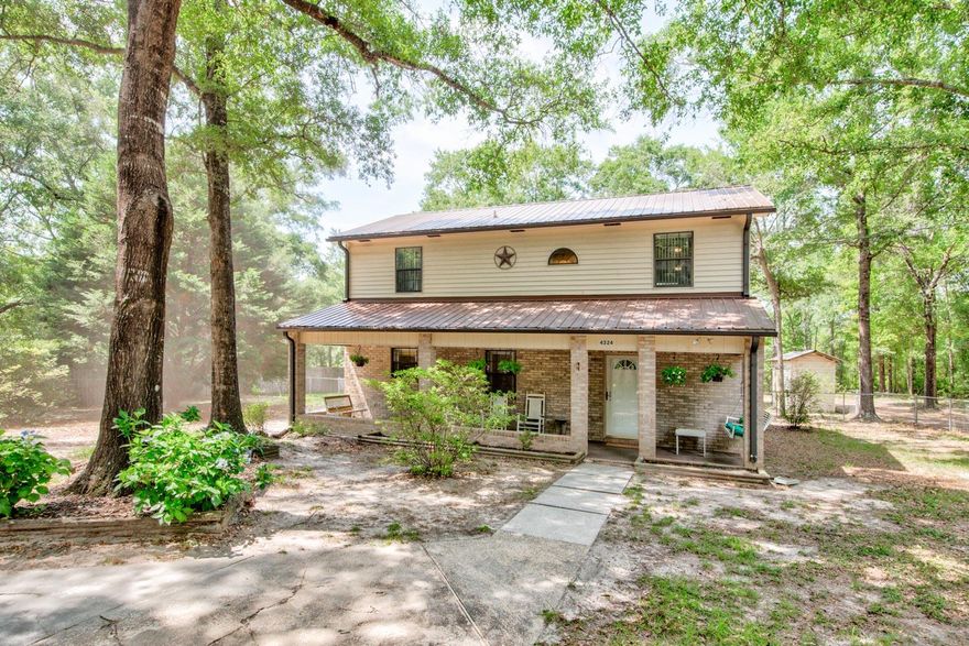 Country living with a short drive to town, bases and the beach! Privacy and Serenity! Check out this 2 bed/2baths country home featuring a bonus room/den, 2146 sqft, home sits on 2.6 acres, has 2 workshops (one is huge (35x35) and the property backs up to a creek, all for under $300k!  On one end sits vacant area with an unfinished garage that has with water, power hook up  and septic. You'll love the extra large walk in pantry. The possibilities are endless as to what you can do with this property! There is an additional room off back patio that can be used as a 3rd bedroom or mother-in law suite. Room includes a shower and sink,  Roof was replaced in Oct 2018.