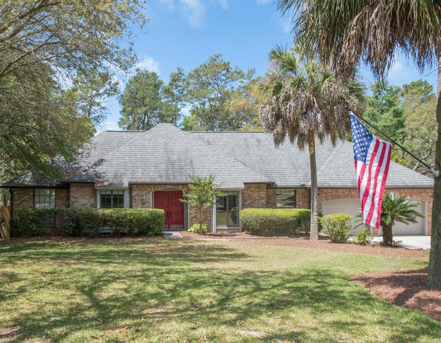 Lake front home on .6 acre lot overlooking golf course and lake in Bluewater Bay. Situated well off the road for added privacy, this all brick home has a yard perfect for being outdoors. Enjoy the beautiful evenings from your deck and gazebo - entertain or relax and enjoy the sunset. Backyard is completely fenced-in. Inside you will find beautiful all wood floors throughout, with tile in the wet areas, new lighting and fans throughout. The over sized living room allows for more than one sitting area, and opens to a room to be used as a formal dining room or study. A highlight of this home is the beautiful sun room that can be used for a den, playroom, or flex space. Completely encased in glass along the back wall, the sun room overlooks the wooded backyard and lake, and is open to the