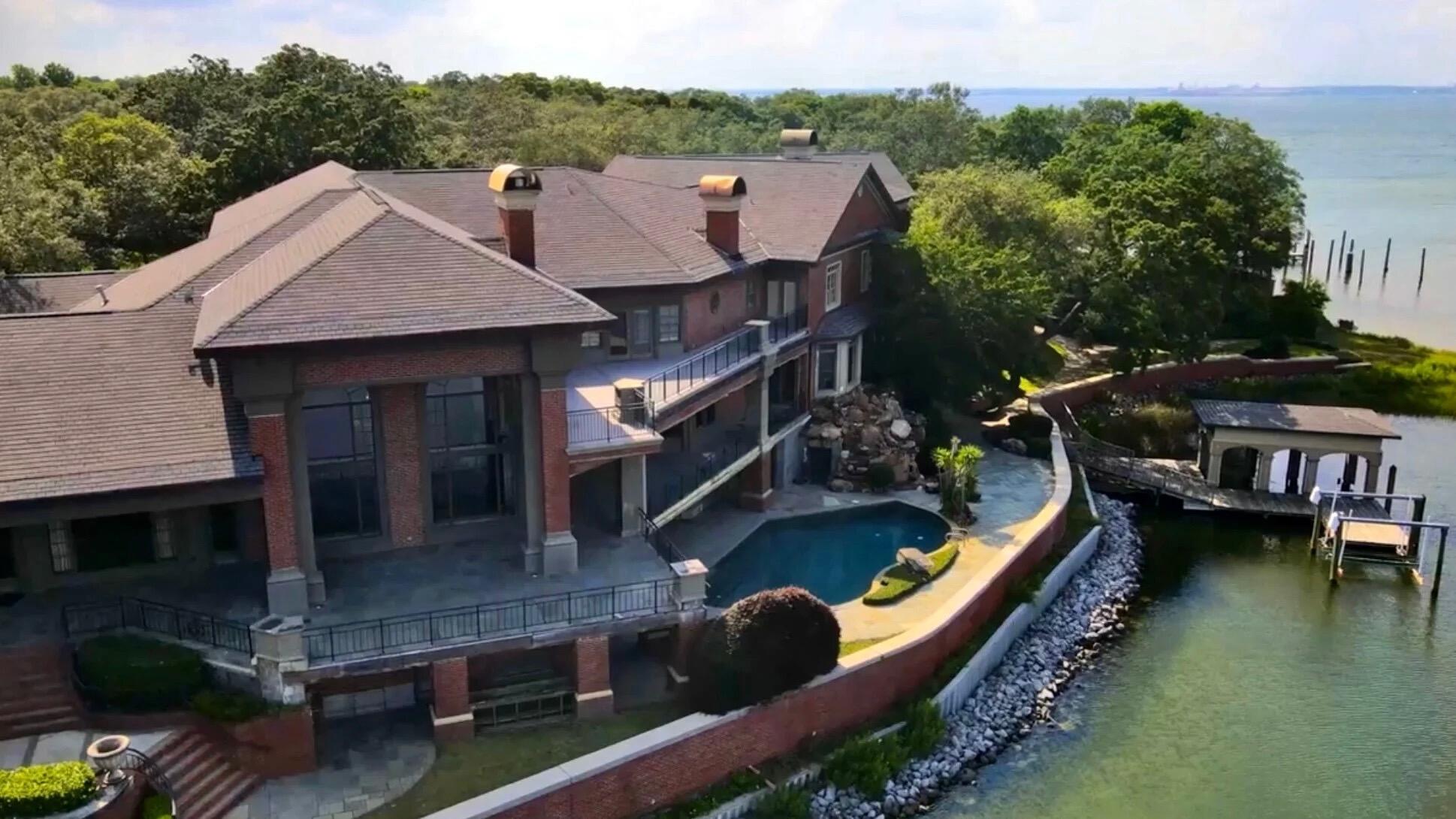 PREMIER WATERFRONT ESTATE - Nestled along 825 feet of pristine waterfront, this 14,203 sq ft estate is a grand architectural masterpiece, offering unparalleled panoramic views of the water. Featuring 2 direct deep-water dock accesses ideal for yachts, this residence is a refined retreat. Over 6,000 sq ft of expansive terraces invite alfresco dining and breathtaking sunset views. The resort-style pool, complemented by a state-of-the-art outdoor kitchen, offers the ultimate venue for grand entertaining. Set on 2.98 acres of meticulously manicured grounds, this private sanctuary combines regal design with timeless elegance. Experience the rare opportunity to own this extraordinary waterfront estate in Gulf Breeze, where unrivaled luxury, and refined sophistication converge.