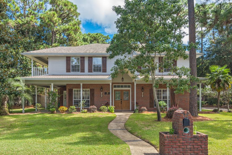 Your gorgeous new home is located on a cul-de-sac in the highly desired, gated community of Southwind in Bluewater Bay. This beautiful 4-bedroom, 3-bath home has great curb appeal - from the custom shutters along the front porch to the inviting landscape.  Nestled on a large lot, this 2700 plus square foot home features high ceilings, hardwood floors, crown molding, recessed lighting, and an excellent traditional floor plan.  In addition to the formal dining room and great room with wood-burning fireplace, there is an adjacent room with French doors that is currently used as a media room.  It would also make a great home office or playroom.  The bright kitchen features a breakfast area with bay window, built-in desk, large pantry, and stainless-steel appliances.  The adjoining hallway