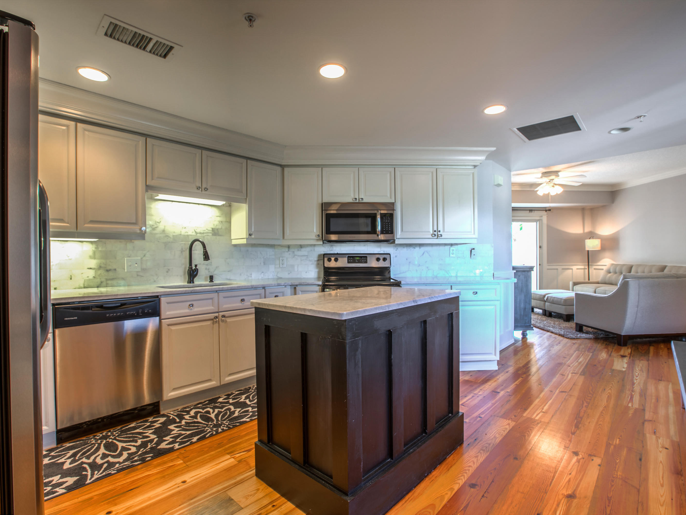 This is a must-see renovated beauty that truly stands out in Westwinds. This knockout 2 bedroom unit was updated in September of 2014 and is turn-key ready with added convenience of being located on the Westwinds lobby level. The contemporary design incorporates lavish furniture and finishes with a relaxed beach-side condo atmosphere. Antique honey-colored hardwood floors, new furniture, and mounted flatscreen TV's are throughout. There was a complete kitchen overhaul adding stainless appliances, white marble countertops, backsplash, and a large floating culinary island. Even the bathrooms shine with class from the bright white marble to the new brass finishes. Westwinds offers one of the best pools on the resort along with a fitness center, covered parking garage, community room, tiki