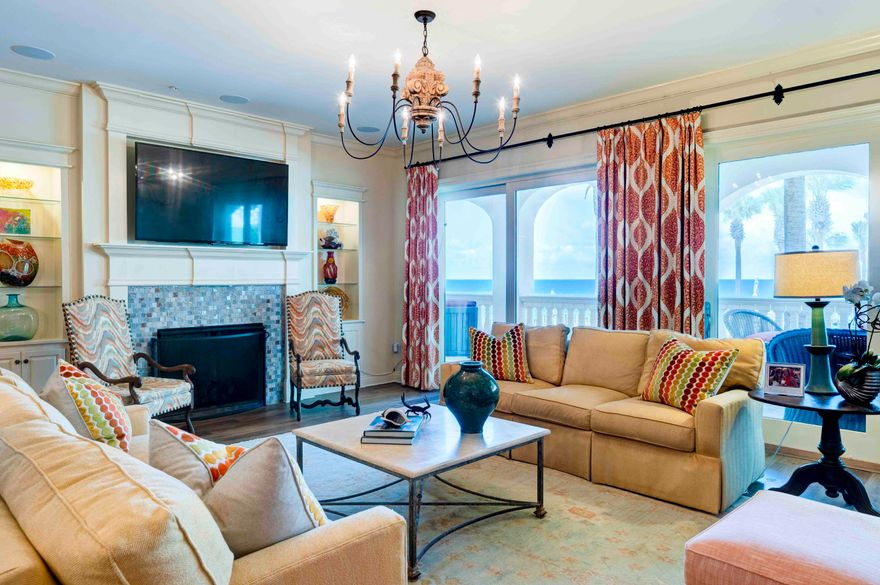 Welcome to C101, step into the largest three bedroom three and one half bath condominium home, in Bella Vita on Blue Mountain Beach boasting over 2735 square feet with 530 square feet of veranda with breathtaking views rising above the gulf, sparkling pools and stunning piazza.  Rarely does a condominium home in Building C with only 9 residences become available.  Beautiful azure blue Gulf waters unfold before your eyes drawing you out to the terrace which spans the breadth of the residence.  This immaculate corner condominium home with fireplace and premier media is a highly coveted first floor walk out and features over $500K in furnishings and upgrades including impact glass doors and windows, and front door installed in 2024, as well as two HVAC systems installed in 2024. C101 enjoys a separate storage unit right outside the front door for stowing away extra beach items and there is storage under the building. The C building is contiguous to the beach walk over, pools, steps away from the Sunset Deck for grilling, and adjoins one of the designated spaces for pets.  The Primary Bedroom lets on the veranda and features two walk in closets and the Primary Bath is graciously sized with dual vanities, soaking tub, separate shower and water closet and linen closet.  The quality interior delineations throughout include solid surface flooring, custom gas fireplace, kitchen designed by Linn's Prestige Kitchen with custom cabinetry including a high-end appliances.  The resident chef will enjoy the Dacor 6 burner gas cook top, double ovens, Bosch dishwasher, Kitchen Aid ice maker, and Sub Zero Refrigerator.  The private En-suite Guest Bedrooms are very large and comfortably accommodate guests.  There is a separate laundry room with built in cabinetry and a separate Powder Room. 
Gated Bella Vita in Blue Mountain Beach comprises a total of 48 residences with 365 feet of beach on approximately 6 acres, a Great Hall with conversational seating, a Library, porte cochere and an excellent Fitness Center to encourage work out enthusiasts to stay fit while at the beach. Convenient to Bella Vita on Blue Mountain Road is the 30A bike path, coastal towns, bike shop, restaurants, health food store, donut and ice cream shop and shopping. We invite you to discover Bella Vita 30A's best kept secret where pride of ownership is reflected in attention to detail in the quality maintenance of the buildings, the landscaped grounds, parking, and amenities.  Plug in and start playing and enjoy carefree life at the beach in C101!  Bella Vita....is the Beautiful Life   