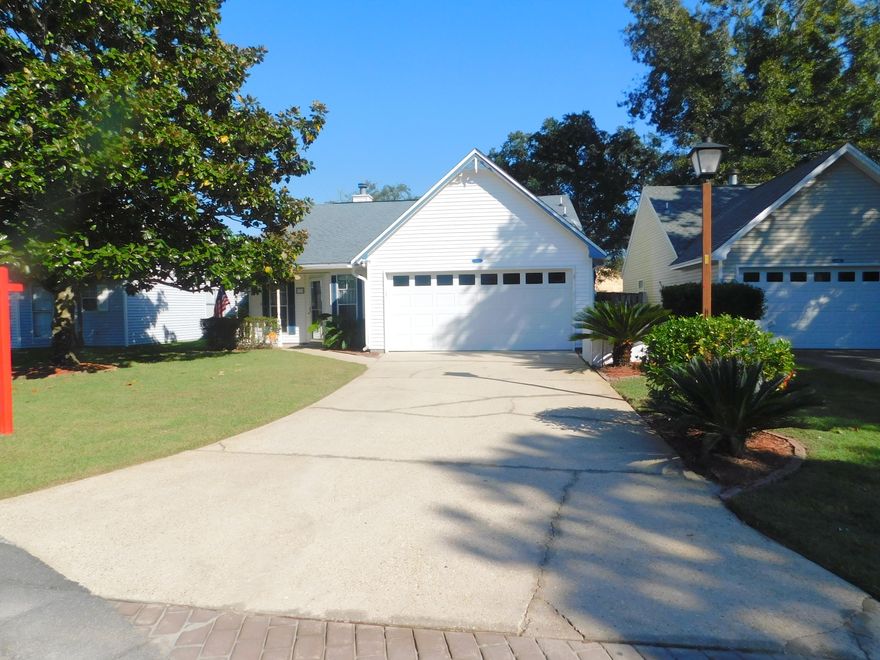 Charming Florida Cottage in Niceville's Blue Pine Village conveniently located across the street from Bluewater Elem, a consistent A+, top performing school. All tile floors (no carpet), elevated ceiling in living room for spacious feeling, floor to ceiling stone fireplace for those coming chilly evenings. Eat in kitchen that leads to a glassed Florida Room features a pantry, garden window (great spot for growing herbs), a smooth top stove and microwave. (Don't miss the pull out drawers) Master features double French doors that also open to the Florida Room. Lawn has been professionally maintained and is healthy and green.