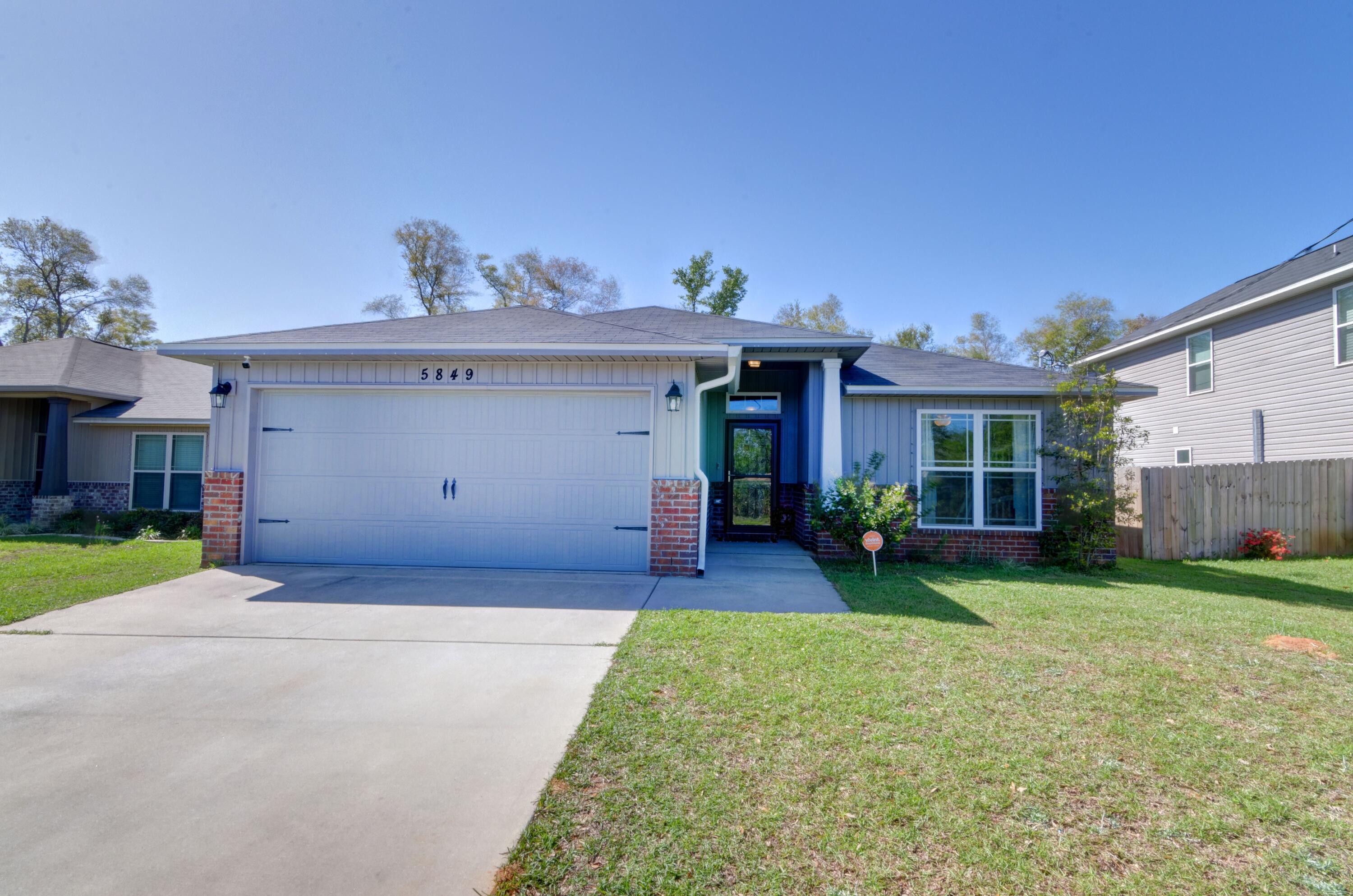 Welcome home to this only 3 year old craftsman style home on quiet street conveniently located close to Whiting Field, Navy Federal and tons of food and shopping! This 3 bedroom 2 bath home complete with solar panels for energy cost savings has a beautiful great room with soaring vaulted ceilings and open kitchen design with wood vinyl plank flooring throughout all the common areas. Granite counter tops, stainless appliances, recessed lighting, and a spacious pantry adorn the beautiful kitchen. The split floor plan has two spacious bedrooms on one side of the living room with a shared bath between them, and on the other side of the eat in kitchen space you'll find the huge master bedroom through french doors. The large master bathroom has a MASSIVE walk in closet, double vanities, stand