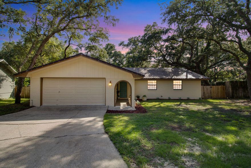 Welcome to this stunning, move-in ready home nestled in the highly desirable Bluewater Bay community--where you'll enjoy access to a boat launch, fishing spots, golf, marina, picnic areas, playground, tennis and pickleball courts, and pool access--all with no HOA!Situated on a spacious lot surrounded by mature trees, this home offers incredible curb appeal with fresh exterior paint, updated front landscaping (2025), and a metal roof for long-lasting durability. The extended driveway and 2-car garage with built-ins and a workbench provide plenty of room for parking, storage, and projects.Step into a freshly painted interior featuring updated LVP flooring, carpeted bedrooms, and abundant natural light from large windows outfitted with new window treatments. SEE MORE... The entryway welcomes you with custom mudroom built-ins and barn door accents, adding charm and practicality.

Enjoy a cozy yet open layout highlighted by a wrap-around fireplace that beautifully separates the living and dining areas. The fully updated kitchen is a chef's dream, complete with quartz countertops, updated cabinetry, and a classic subway tile backsplash.

Retreat to the spacious master suite featuring a walk-in closet and a beautifully updated bathroom. Additional bedrooms are generously sized, and the home offers plenty of extra storage throughout.

Relax or entertain on the large, freshly painted covered back deck, overlooking a shaded backyard that provides privacy and space to enjoy the outdoors year-round.

This home offers the perfect blend of modern updates, classic style, and community perkswithout the restrictions of an HOA. Don't miss this opportunity to own a piece of Bluewater Bay living at its best!