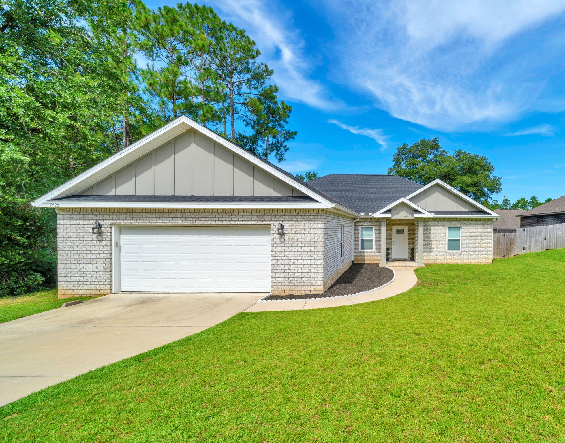 Welcome to this beautifully custom-built 4-bedroom home in the sought-after Duggan Pond Estates, perfectly located in South Crestview just a short drive to local military bases, schools, shopping, and the beautiful Emerald Coast beaches! Step inside and enjoy the spacious semi open-concept layout featuring durable luxury vinyl plank flooring and soaring 9-foot ceilings throughout. The split floor plan offers privacy and functionality, with the primary suite boasting a custom-tiled walk-in shower for a spa-like experience.The kitchen and living area flow seamlessly to a large outdoor deck perfect for entertaining family and friends. Additional highlights include an oversized 2-car garage with extra space for storage or projects, a VA assumable loan, a transferable termite bond, a transferable home warranty, and a survey already on file making your move-in process even smoother. Enjoy added privacy with the home located next to a massive green space owned by the HOA, ensuring peaceful views. This home combines quality craftsmanship with everyday comfort don't miss your chance to own a piece of South Crestview living!