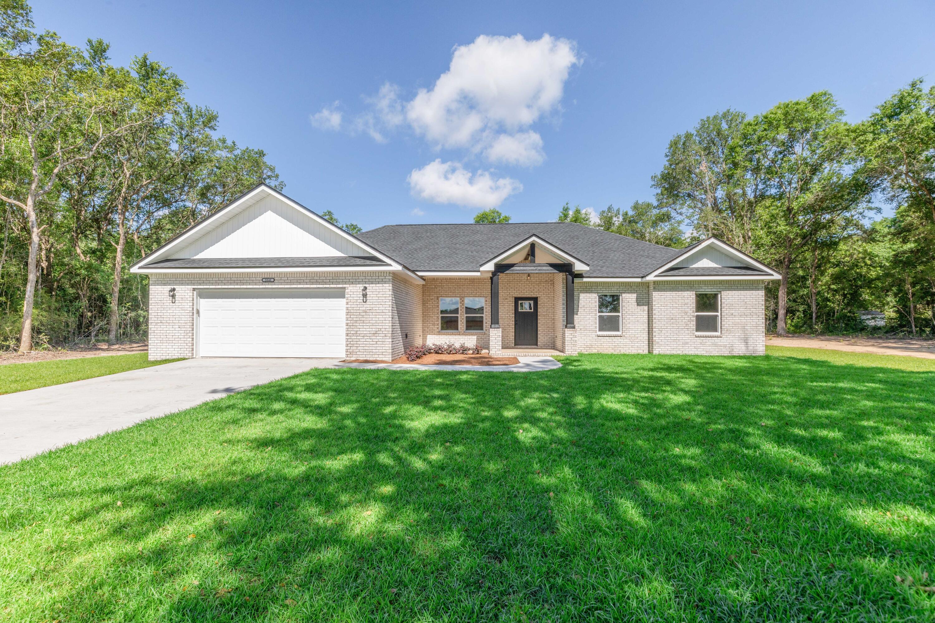***NEW CONSTRUCTION HOME IS NOW COMPLETE*** on 1.01 ACRE LOT in Crestview!!! $5,000 CREDIT TOWARDS BUYERS CLOSING COSTS! This 4-bedroom 2-bathroom 1947 sq ft brick front home with vinyl siding boasts an open concept split floor plan that buyers have come to expect. This home will have beautiful finishes to include: LVP flooring throughout (no carpet), granite counter tops in the kitchen and bathrooms, all wood cabinetry, ceiling fans throughout, stainless steel appliances (refrigerator, smooth top range, microwave, and dishwasher and corner pantry. This plan offers a large living room, formal dining room w/ tray ceiling, and open concept kitchen with massive island and breakfast bar. Enjoy the large master suite with tray ceiling. Master bath offers huge closet, double vanities, water closet, linen closet, and shower. On the opposite side of the home, you will find a three additional spacious bedrooms and a full bathroom. The home will have a spacious 2 car garage that leads to an interior hallway that leads to a mud room / laundry room. The exterior of the home home offers dimensional shingles, covered front porch in both the front and back yard. Don't forget the MASSIVE lot size at nearly 1 ACRE. This lot has been cleared with a 10-15 foot tree line around the property full that ultimate feeling of privacy. You will have plenty of room to add a yard building, boat storage, RV storage and more.... Estimated completion of this home is Spring of 2025. Buyer may have choice of colors depending on when the home goes under contract.
Don't miss out on your opportunity to own your NEW dream home on a large piece of land at an affordable price. Schedule your showing today!