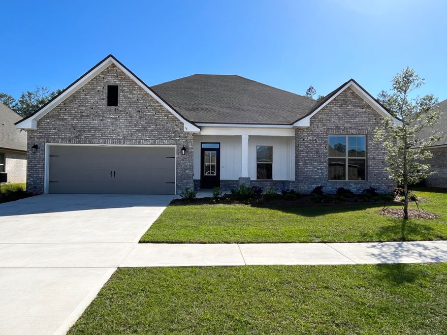 The COMSTOCK III G in The Trails at Hammock Bay community offers a 4 bedroom, 2 full bathroom, open and split design. Upgrades added (list attached). Special Features:  double vanity, garden tub, separate custom tiled shower, and walk-in closet in master bath, double vanity in 2nd bath, kitchen island, walk-in pantry, boot bench in mud room, covered porch and patio, recessed lighting, undermount sinks, custom backsplash in kitchen, ceiling fans in living room and master are standard, bronze plumbing fixtures, custom framed mirrors in all baths, landscaping with irrigation, architectural 30-year shingles, flood lights, and more! Energy Efficient Features: kitchen appliance package with gas range, tankless gas water heater, vinyl low E MI windows, and more!