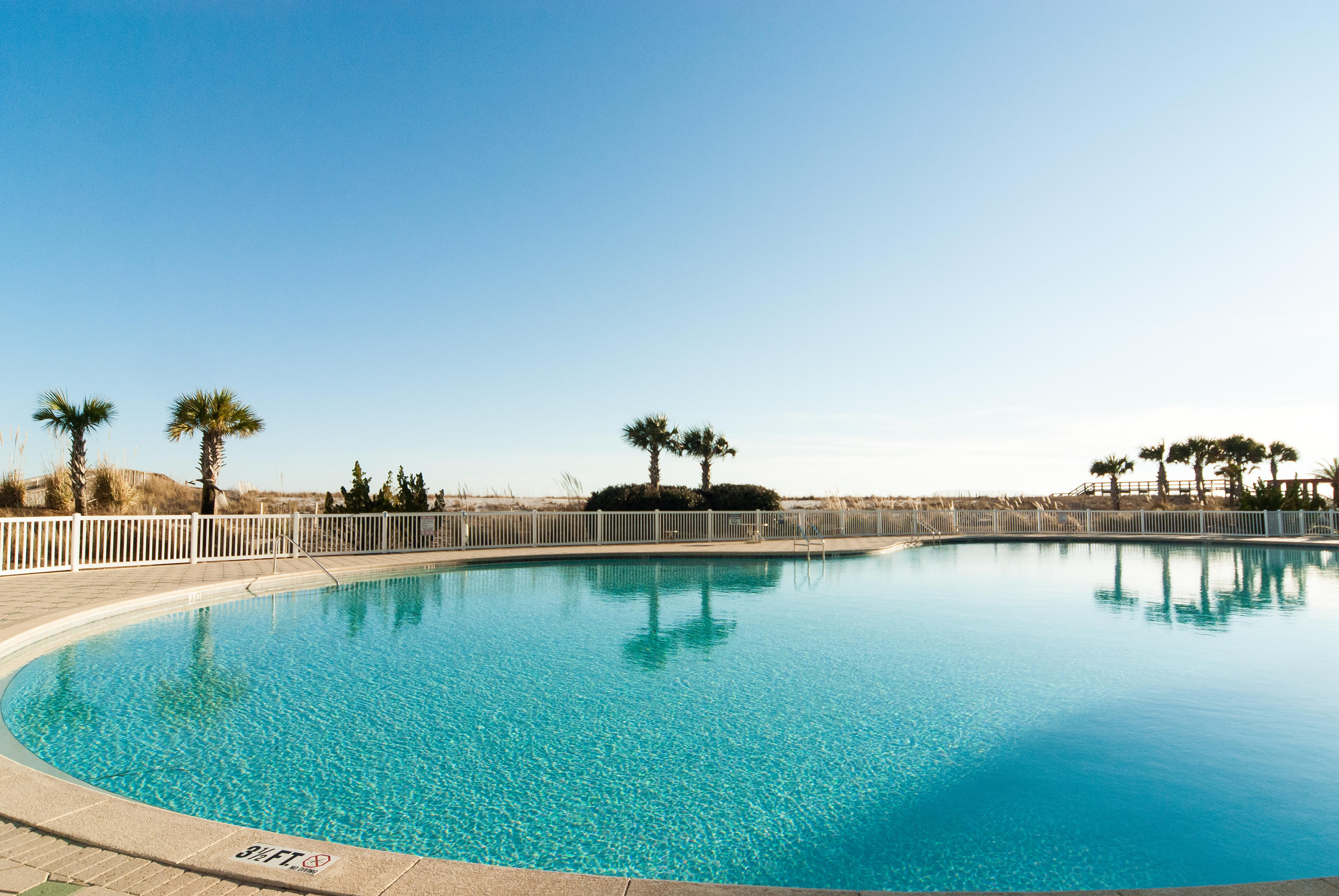The wait is over! Your new home on the Gulf awaits! This is a rare opportunity today to purchase a Never Before Occupied and True Gulf Front residence. Your new home majestically rises above the beautiful uncrowded sandy shores of Navarre Beach and is priced to sell. Take a dip in the large pool, relax on the sun terrace, and dig your toes in the white sandy beach. Walk along the shoreline, enjoying views of the beautiful Gulf of Mexico. You and your guests will enjoy condominium living in Navarre Beach at its best. The open floor plan is designed to make beach living easy and enjoyable accommodating family and friends. Graciously sized living areas let on to over sized outdoor balconies that beckon you to relax outdoors and enjoy the gulf breezes, overlooking the emerald green