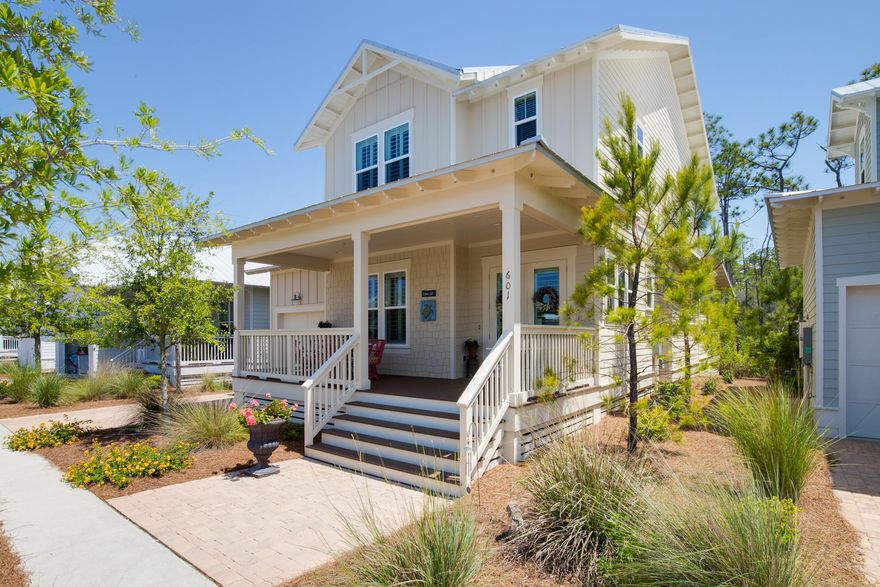 PRICED $100K LESS THAN NEW!! BEST PRICED COTTAGE HOME IN WHOLE COMMUNITY! This beautiful home features an owner's suite on the main floor with a double vanity, soaker tub and separate shower. The second level offers 3 additional suites - one is a secondary master. In the kitchen, you'll find gorgeous Carrera marble countertops, glass upper cabinets to the ceiling, and all stainless-steel GE Monogram and Caf appliances. Wood floors flow throughout the home with tile flooring in wet areas. Unique upgrades include plantation shutters, a built-in air purifier, and screened porch. Enjoy your private screened back porch overlooking nature preserve or the front porch listening to the soothing sounds of the Sunset Pond fountain