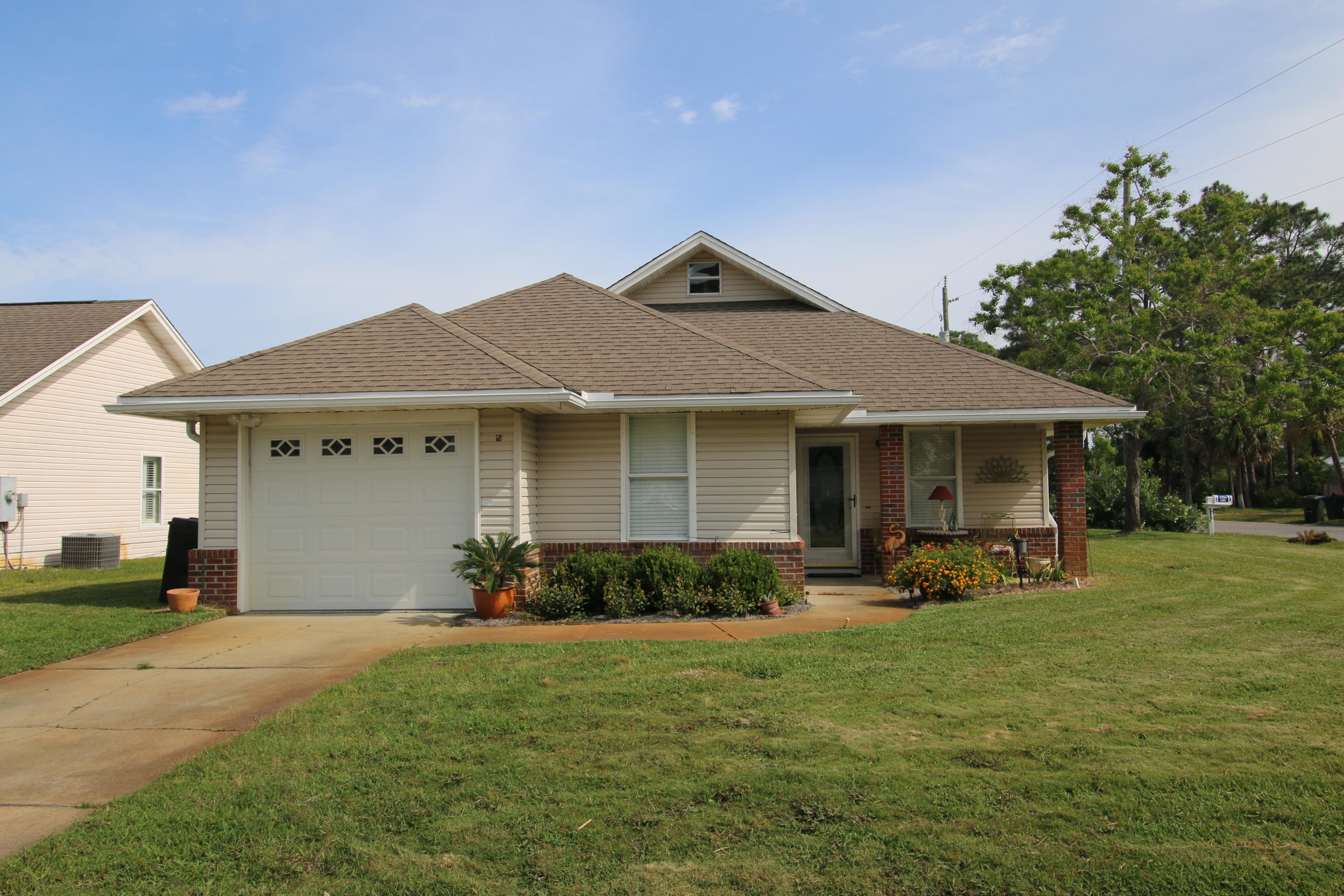 Simply Adorable 2BR/2BA 1,254 Home Located on Large Corner Lot in Great Neighborhood Featuring Tile Floors, White Appliances, Heated & Cooled One Car Garage, Storage Shed, Amazing Screened in Porch with Bay View and Built in Generator. A Short Walk to Legion Park and a Short Drive to the Beach.