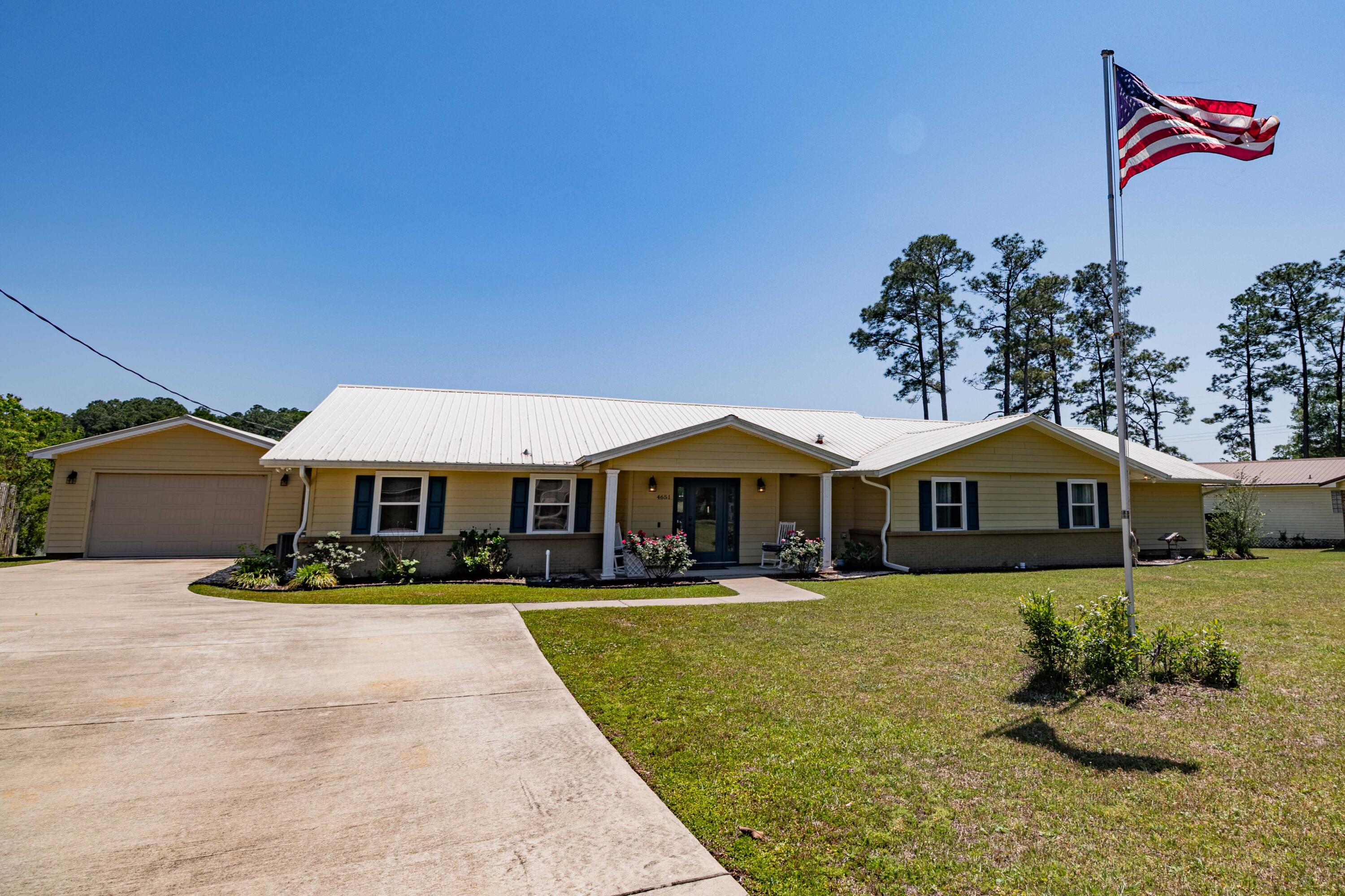 Stunning 3BR/2.5BA Lakefront Home on 0.8 Acres with Dock & Dream Workshop.Beautifully remodeled lakefront home featuring expansive lake views through brand-new 10ft custom windows. Kitchen includes granite countertops, a large island overlooking the water, and plenty of natural light. Newly renovated spa-style bathroom, tile flooring in baths and laundry, and carpeted bedrooms and media room. Enjoy outdoor living on the new Trek deck with custom wire fencing, perfect for entertaining.Property includes a private dock, safe room with half bath, new generator, and a custom stone mailbox. The unbelievable show-stopping 2-car drive-through heated/cooled garage and workshop features epoxy flooring, built-in cabinets, toolboxes, blasting cabinet, and air compressor--ideal for hobbyists or professionals.

Originally built in 1977, this home has been fully updated and feels like new. Rare opportunity to own a modern lakefront retreat with top-tier amenities