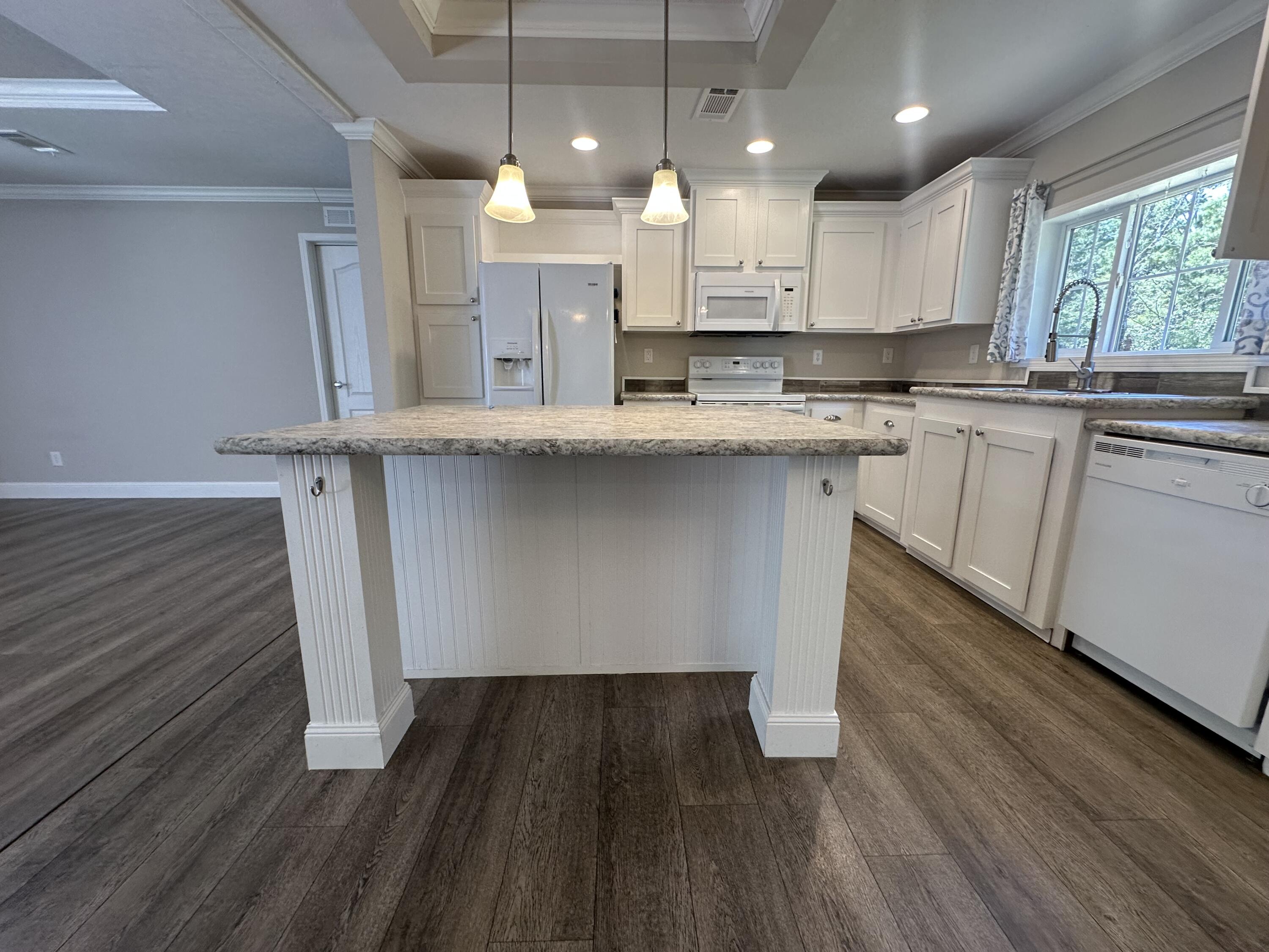Charming 2021 Mobile Home on 4.9 Acres with RV/Boat Parking!Welcome to 203 Delaware Rd -- a beautifully maintained, nearly new 2021 mobile home nestled on 4.9 mostly cleared acres of serene countryside. This spacious home features elegant crown molding, luxury vinyl plank flooring, & a relaxing primary bath with separate soaking tub & walk-in shower.From the dining room, enjoy peaceful mornings or evenings where you may spot deer & their fawns grazing just beyond the yard.The property also includes a 14-foot-high covered carport large enough for 4 vehicles, a boat, or an RV, plus a dedicated electrical hookup for your motorhome--ideal for outdoor enthusiasts or full-time RV living.This is your chance to enjoy country living with modern comforts and plenty of room to grow!